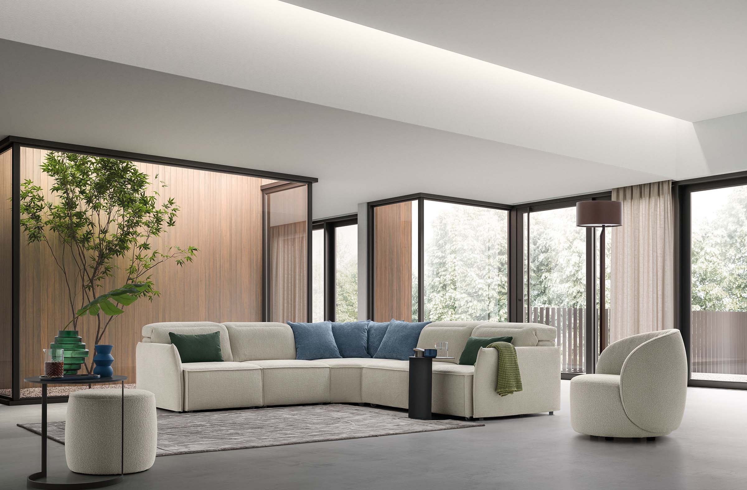 Light-colored four-seater single-shell corner sofa with headrests adjustable to seven different positions.