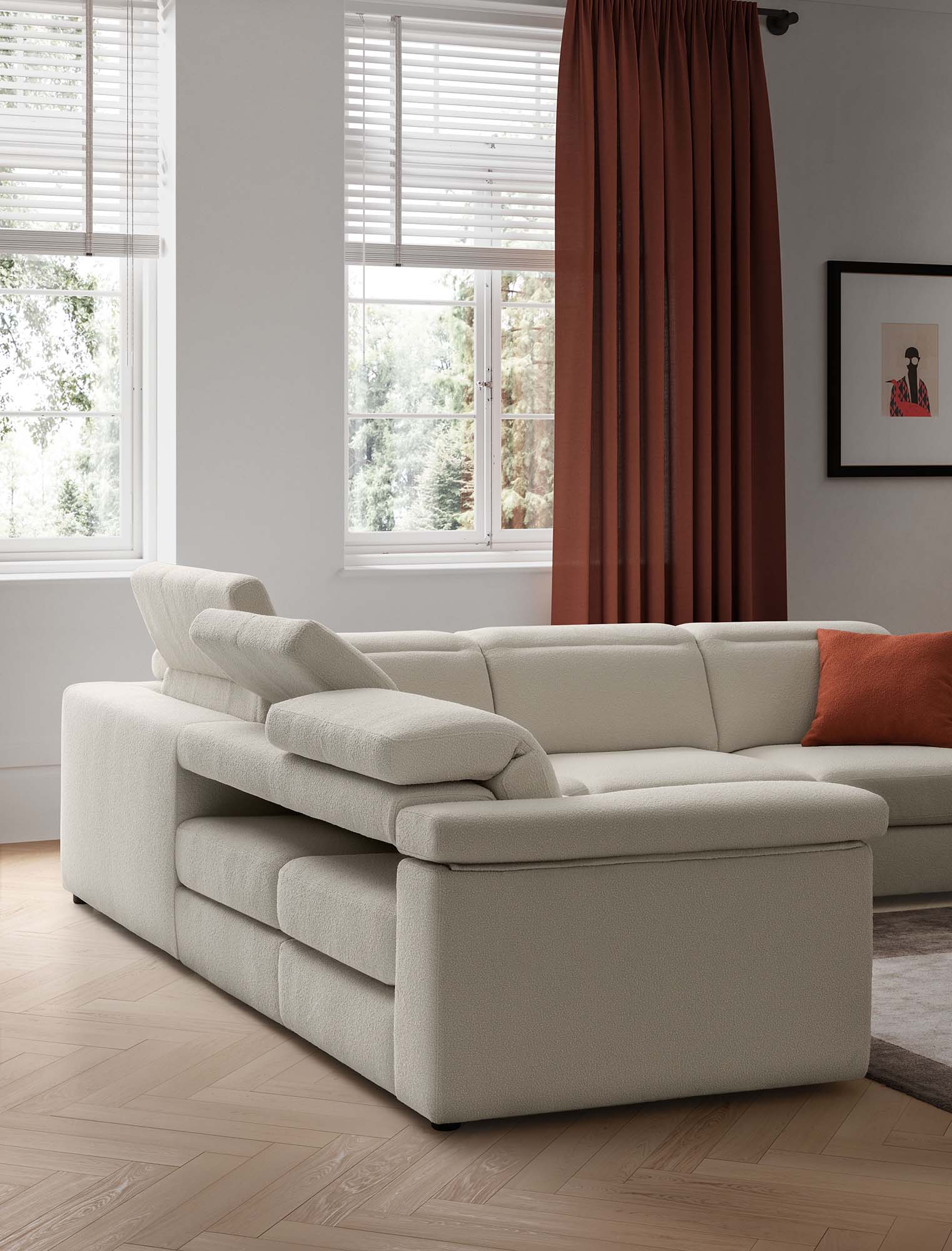 Sofa headrests adjusted in different positions. Off-white fabric sofa in a modern family living room.