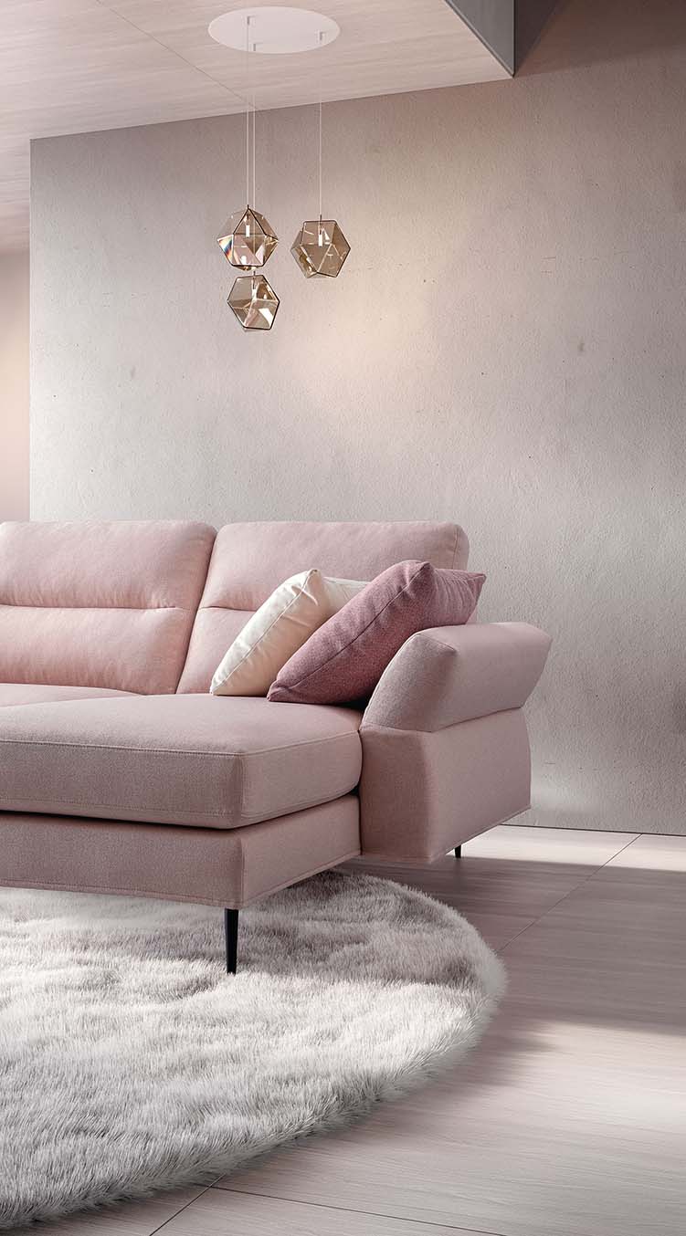Detail of the seat and peninsula of a pale pink upholstered Thoas model sofa. Slender feet and high backrest