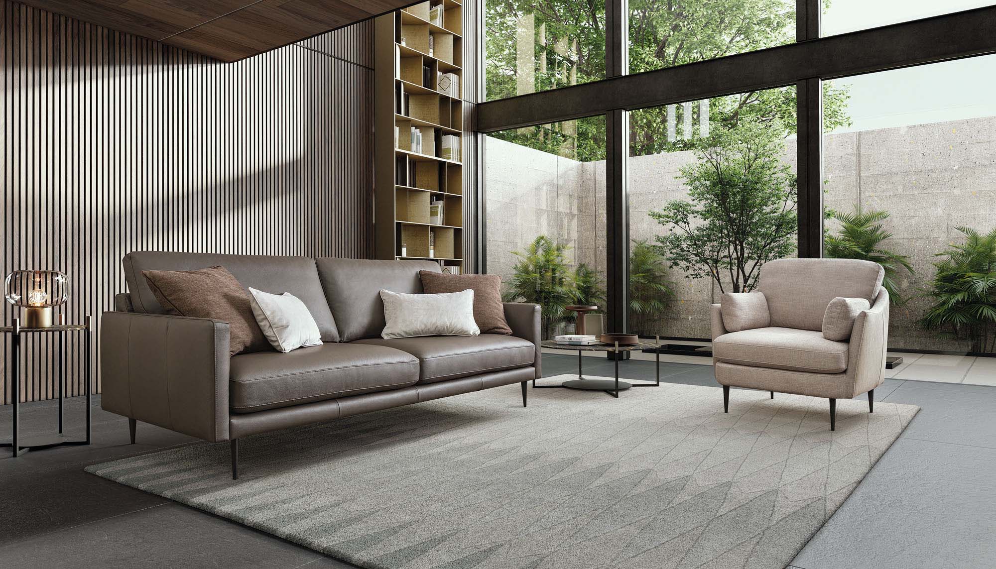 Linear two-seater sofa in brown leather with high legs.