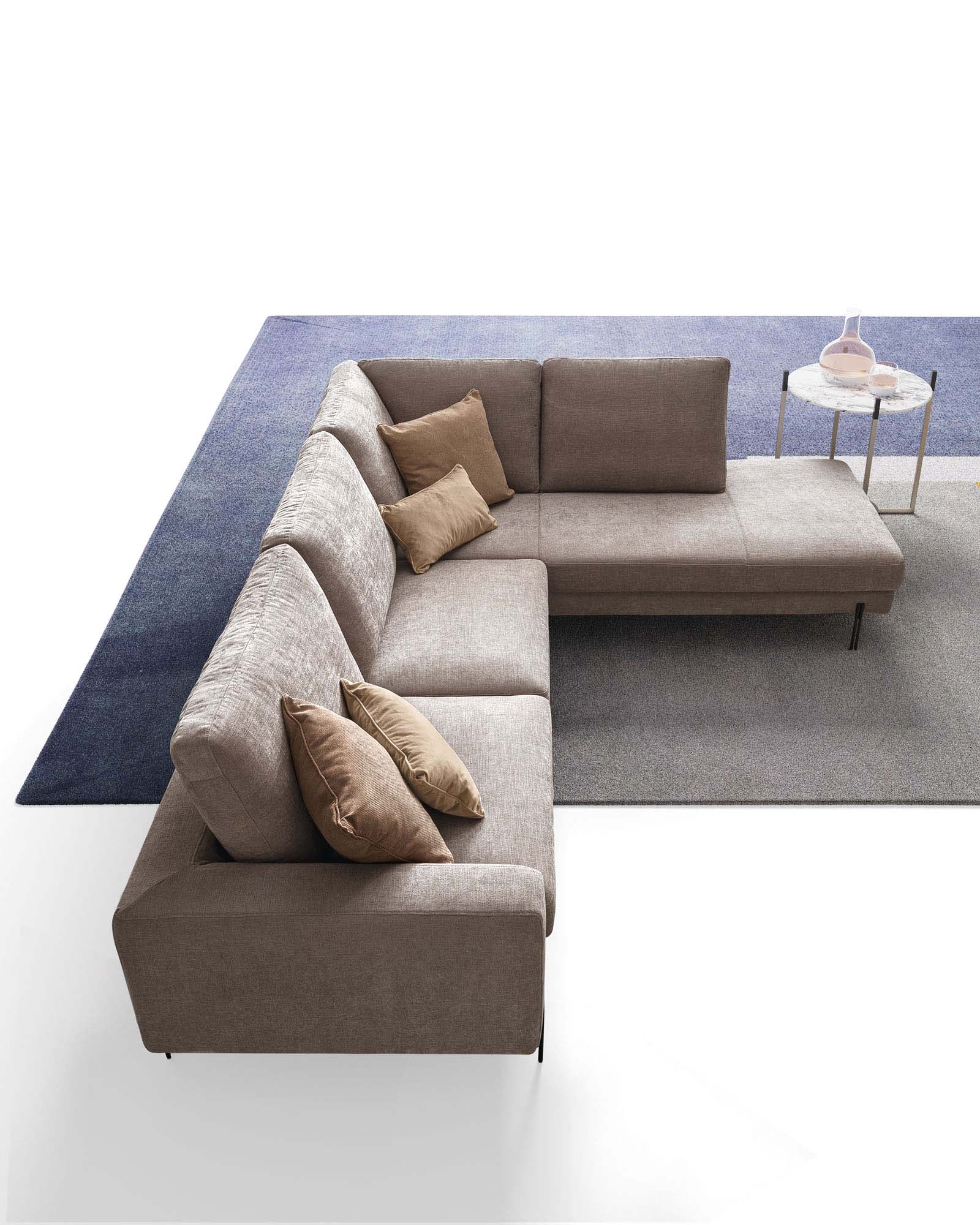 Three-seater fabric sofa in an angular composition with a chaise lounge