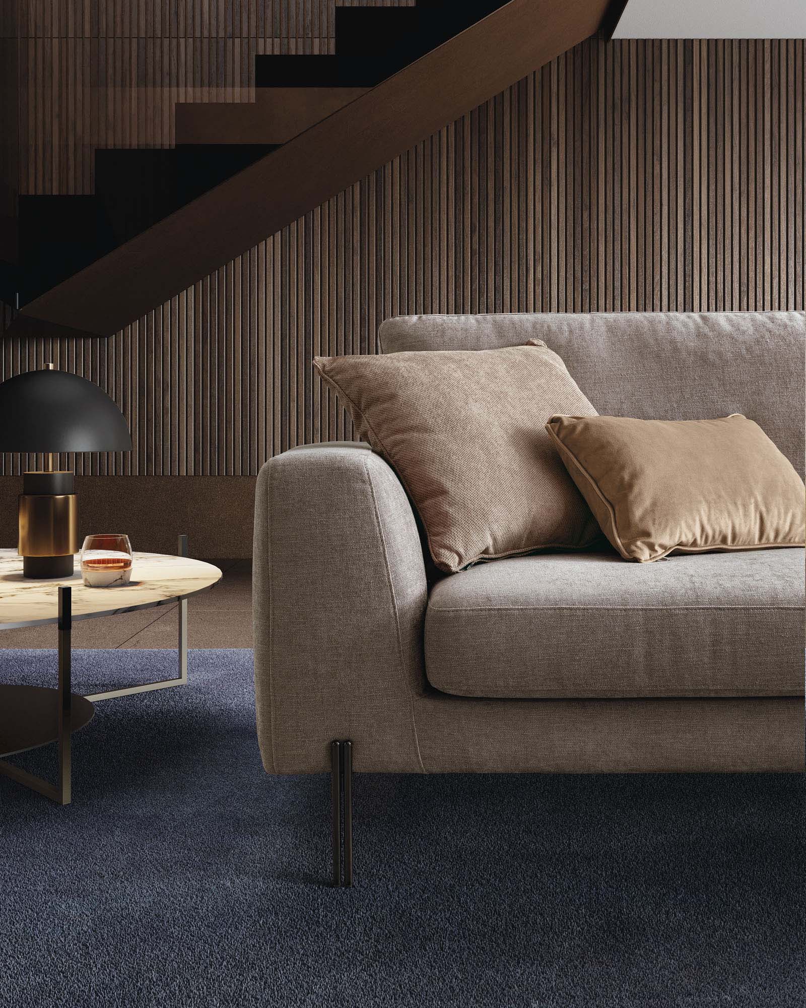 Modern hazelnut-colored sofa with a wide armrest and distinctive legs