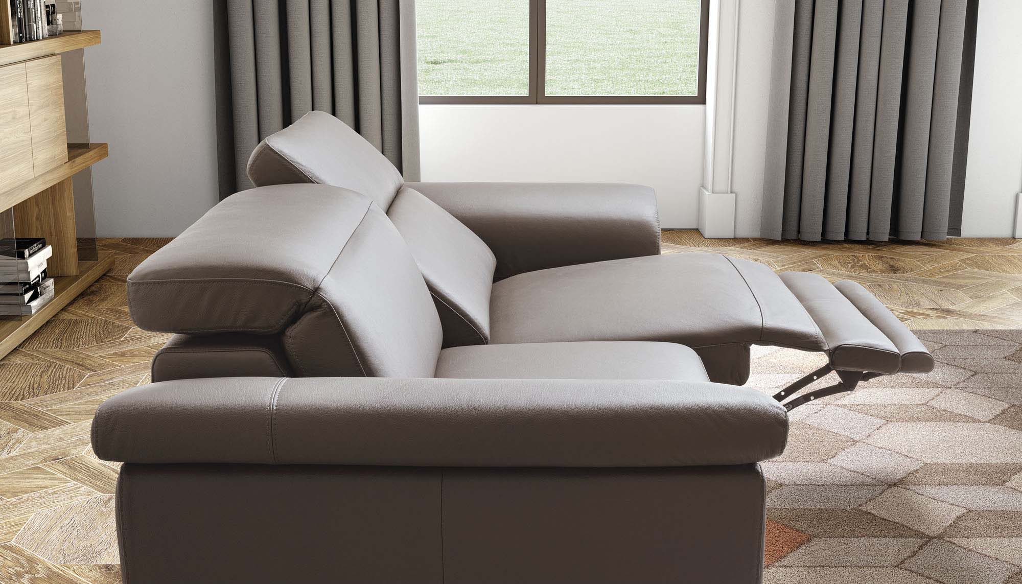 Two-seater leather sofa with a recliner mechanism