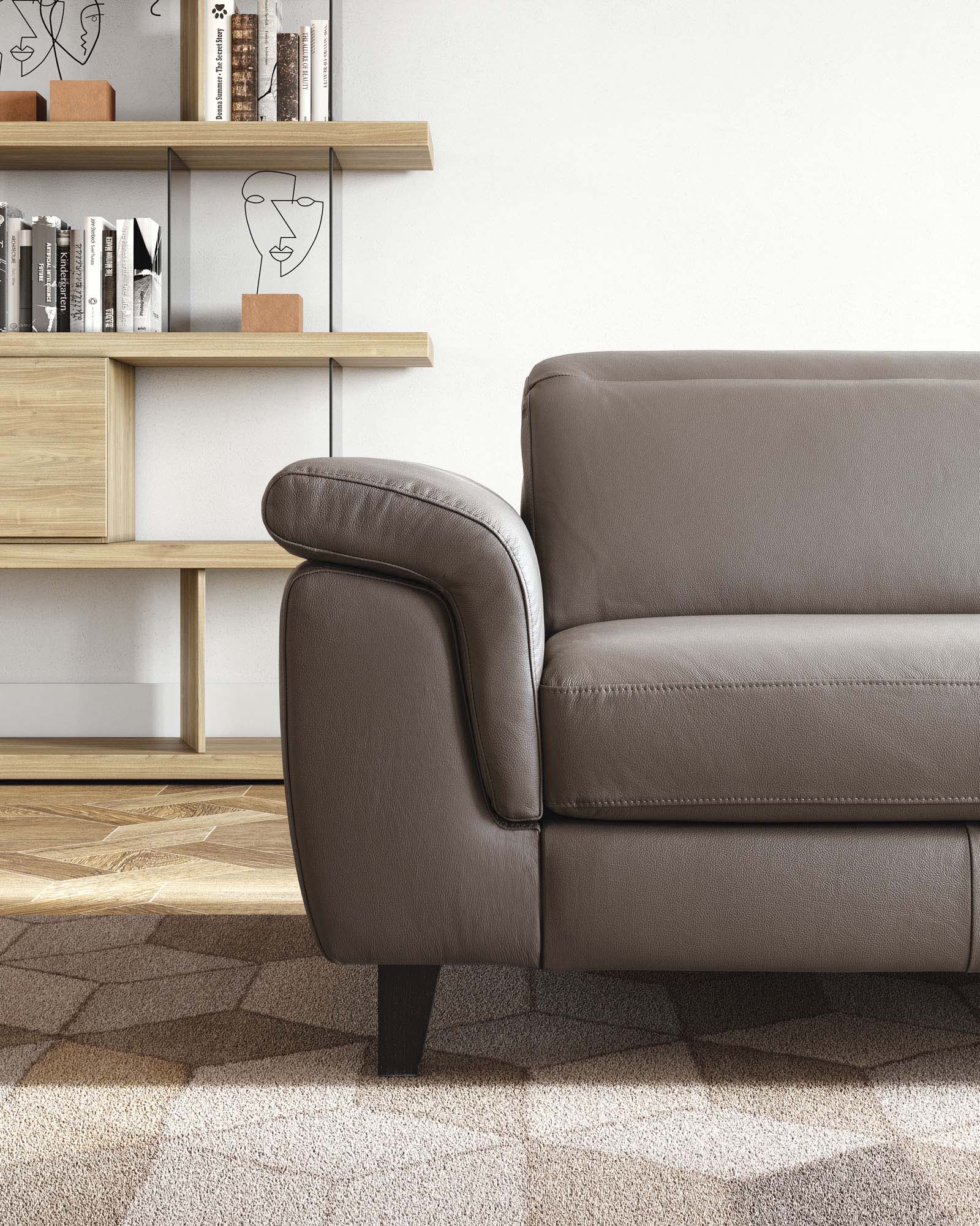 Detail of the classic seat of the Zeno sofa in brown leather