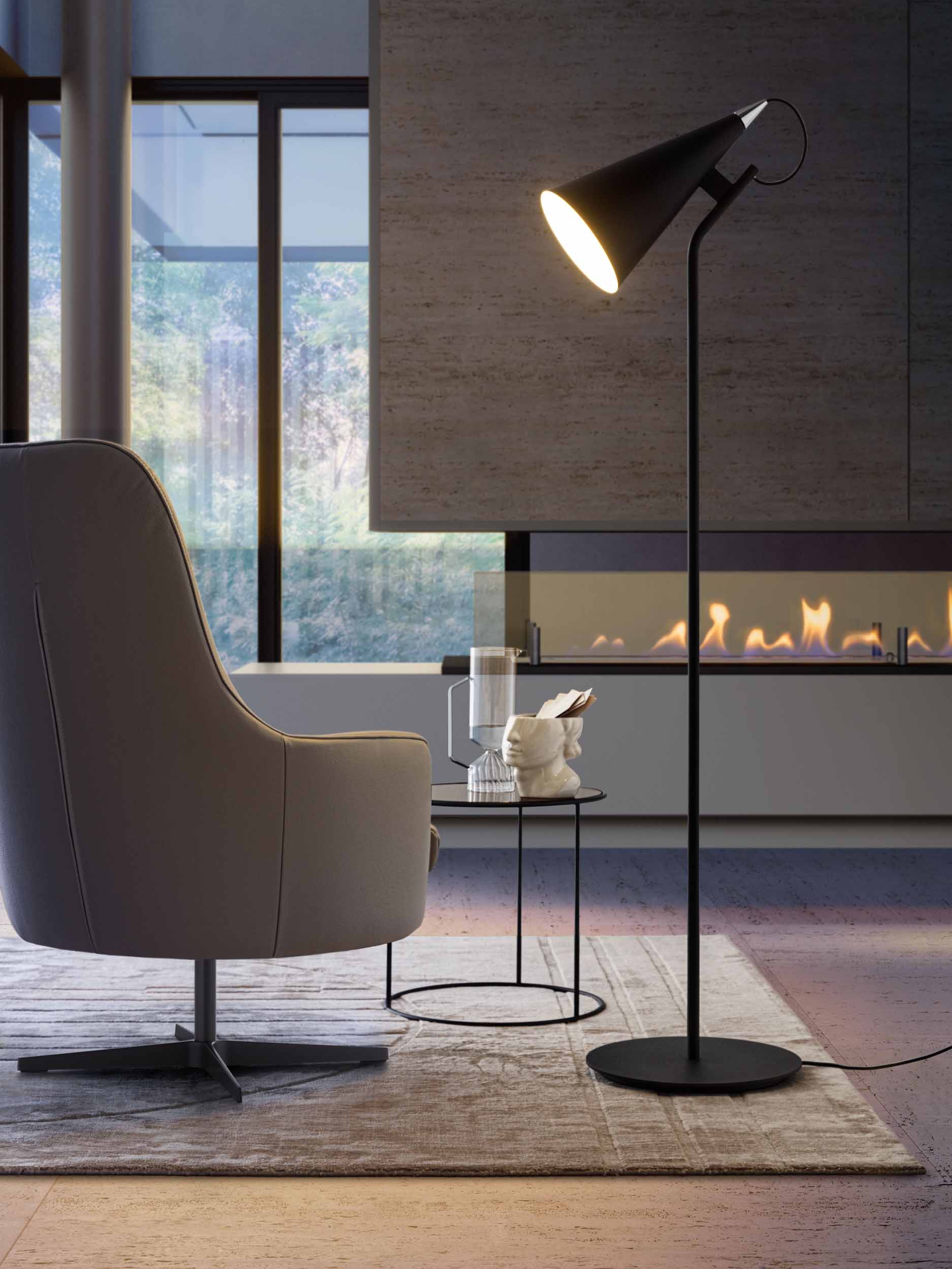 Conical lamp with direct emission used as a reading light in the living room.