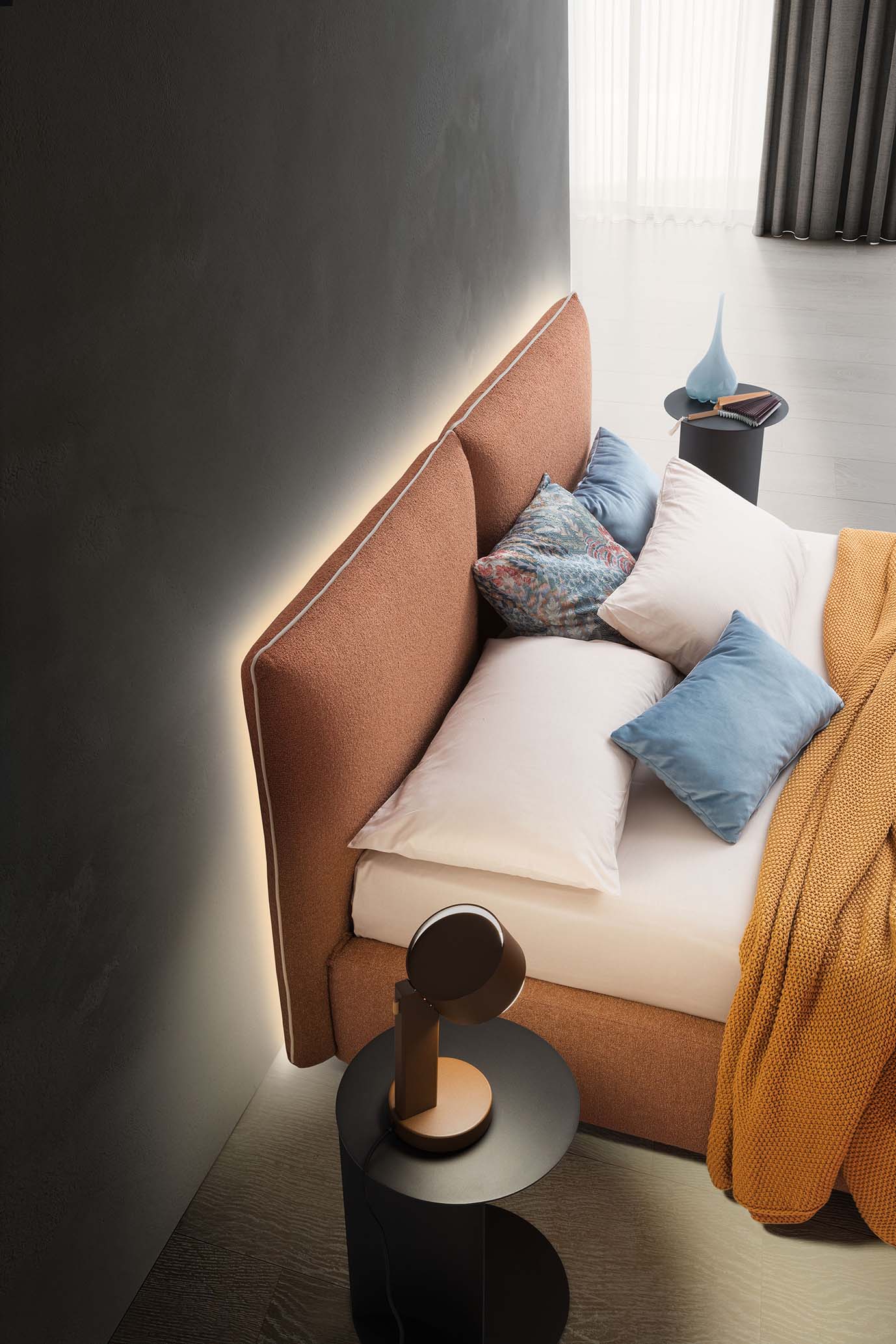 Bed with cushion headboard and backlit panel