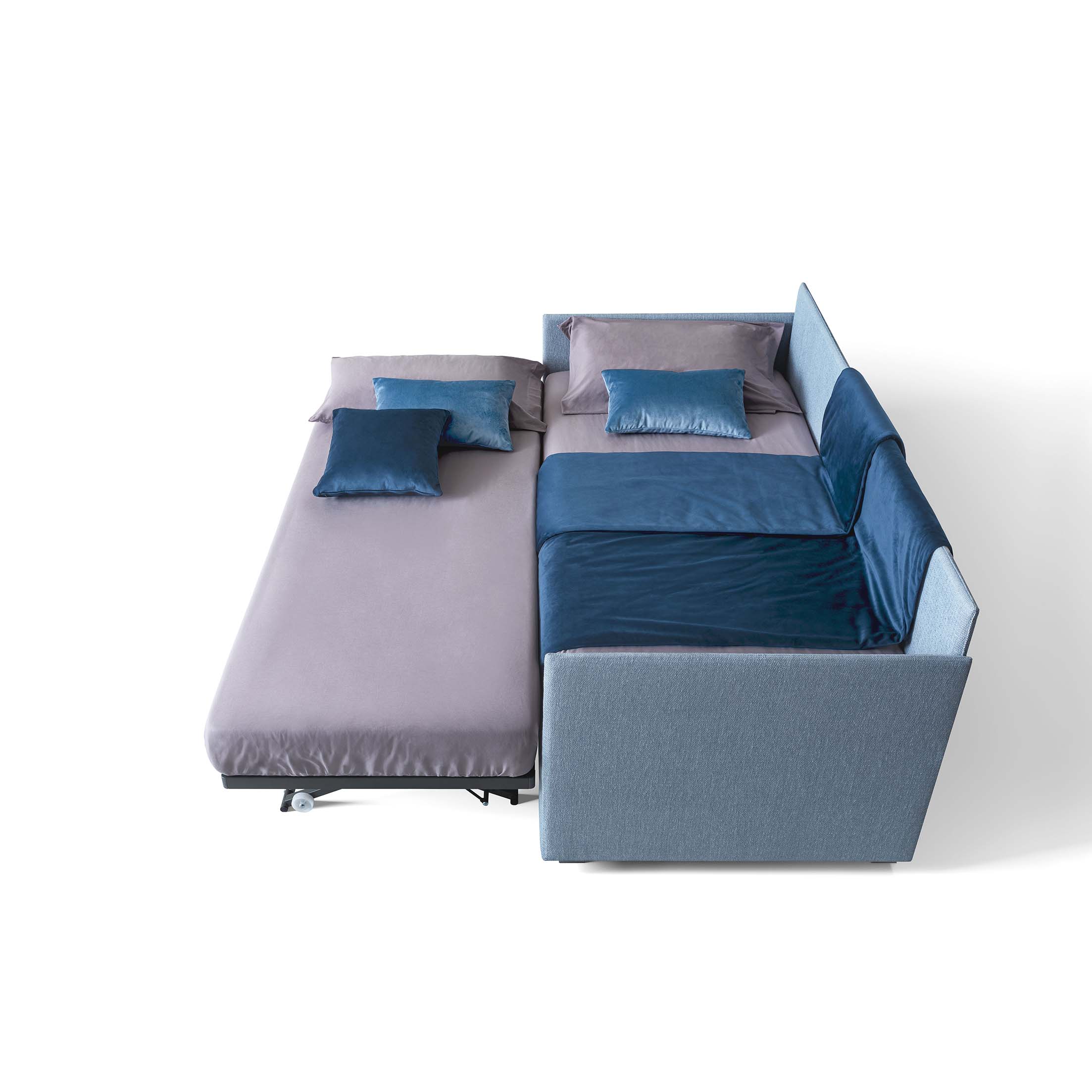 The additional bed pulled out from the base of the main bed is placed side by side to create two attached beds