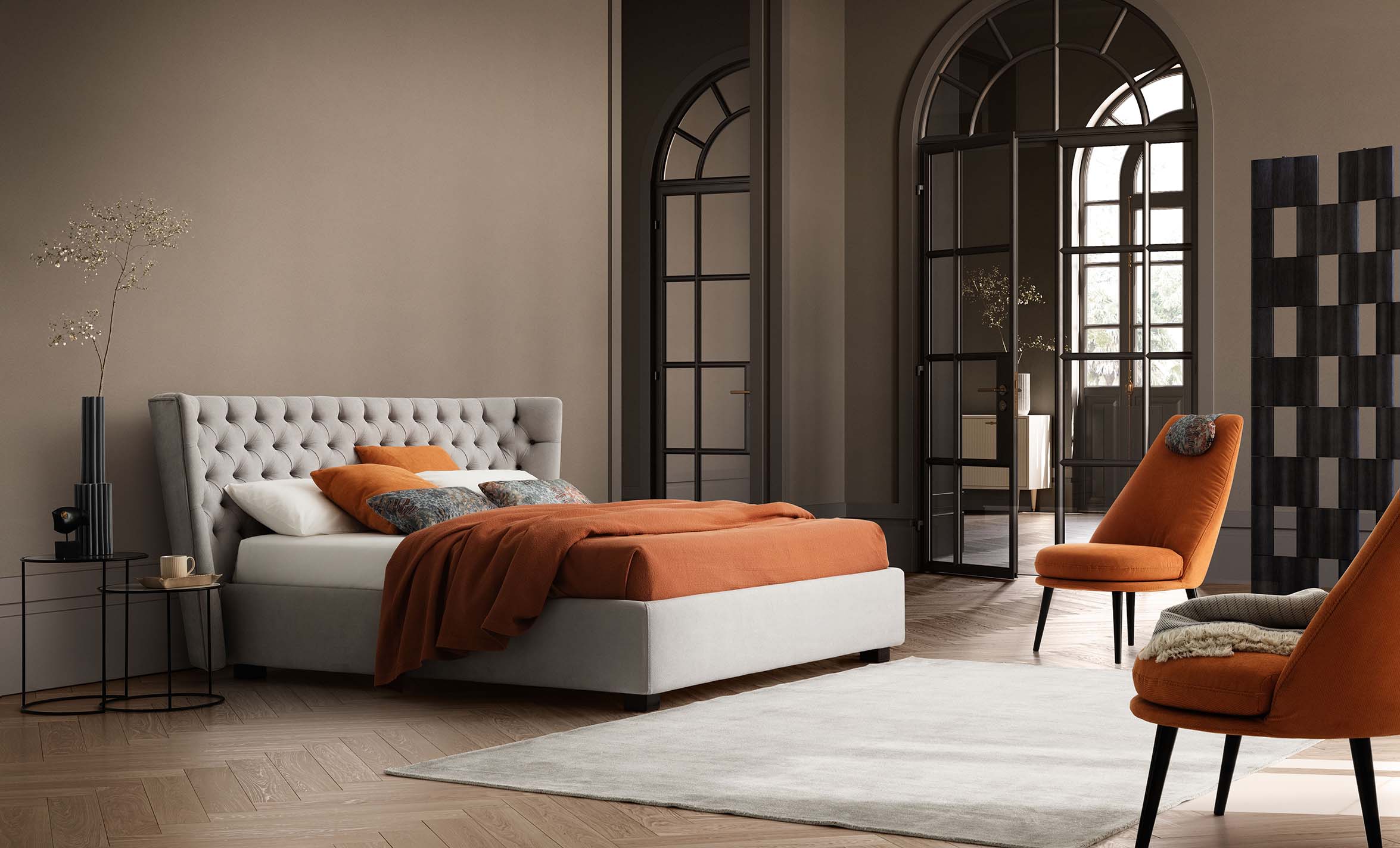 Classic room furnished with a Chesterfield-style bed with low feet and a wide bed frame
