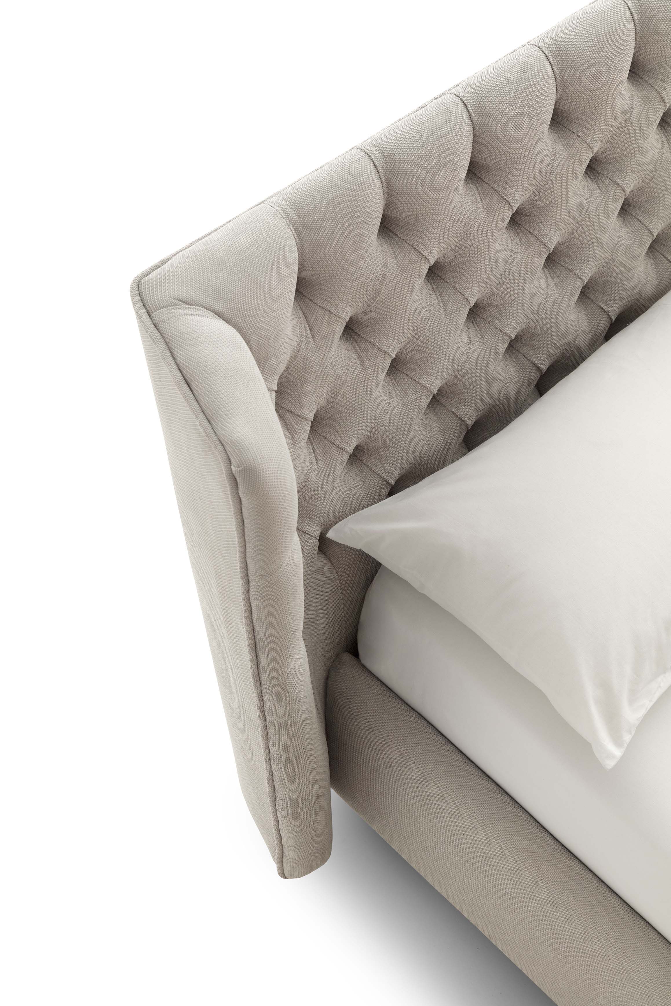 Detail of the cream-gray Caravaggio bed tufted headboard