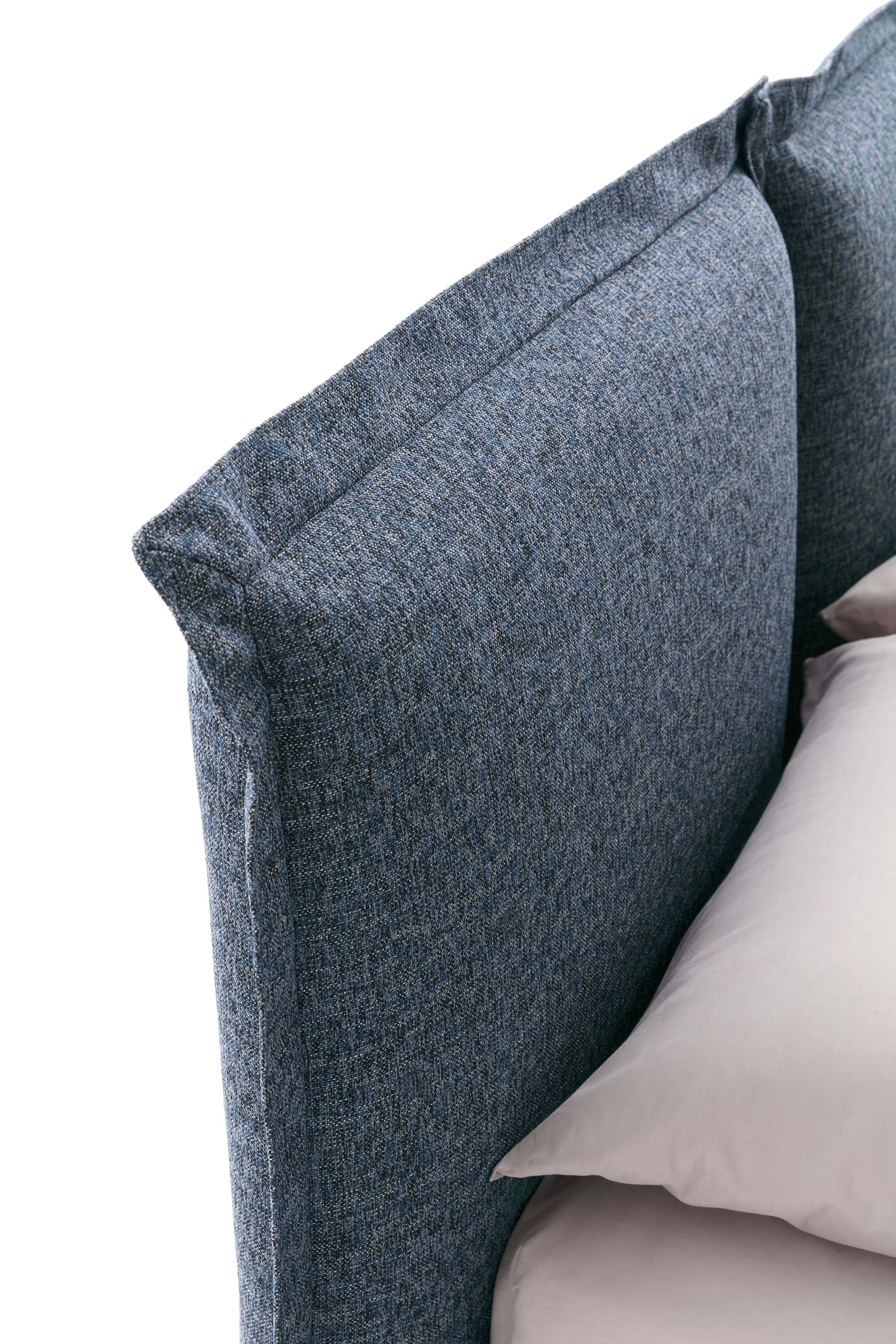 Detail of the Catlin bed headboard with wide fabric profiles