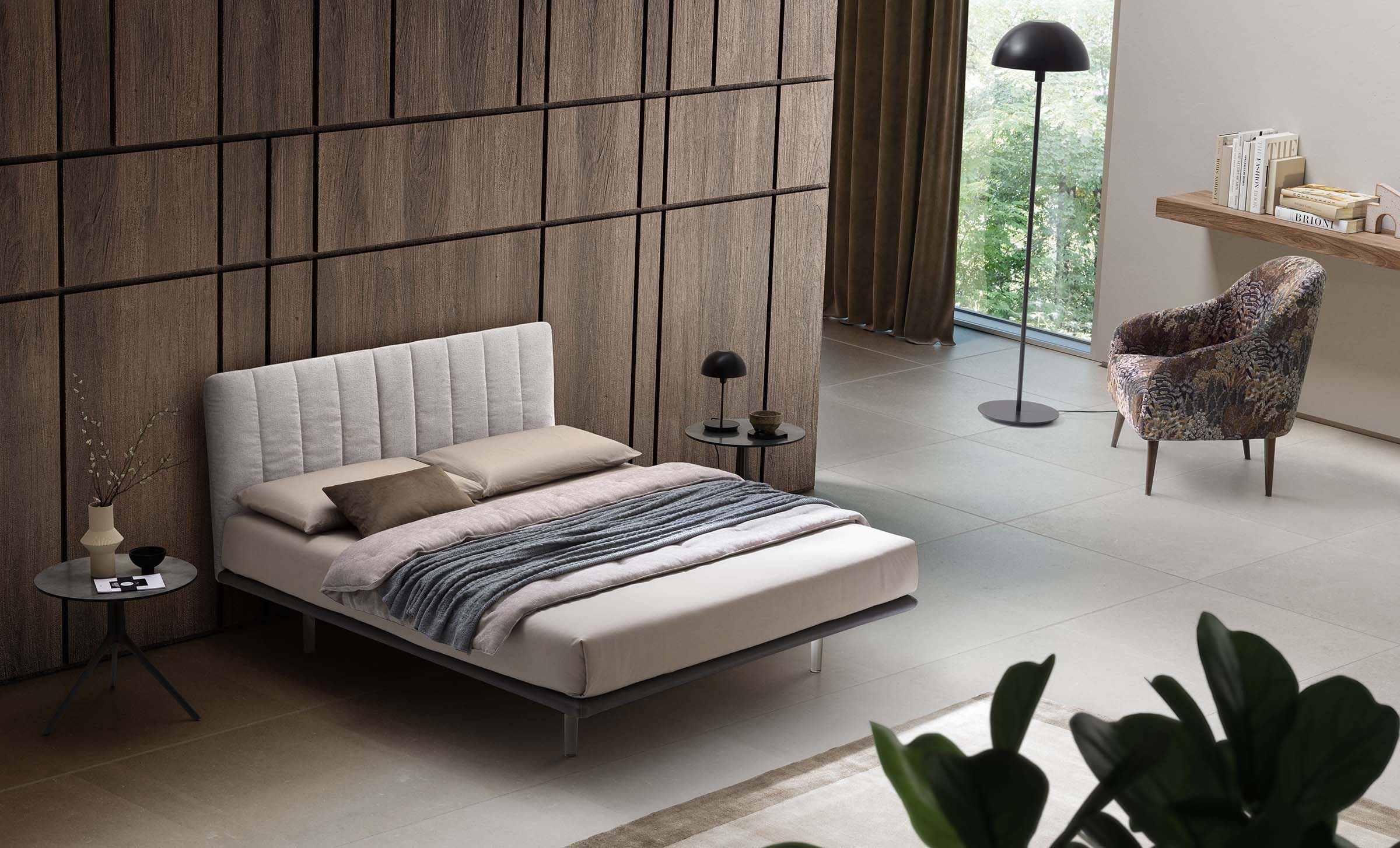 Designer room furnished with a white, space-saving designer bed.