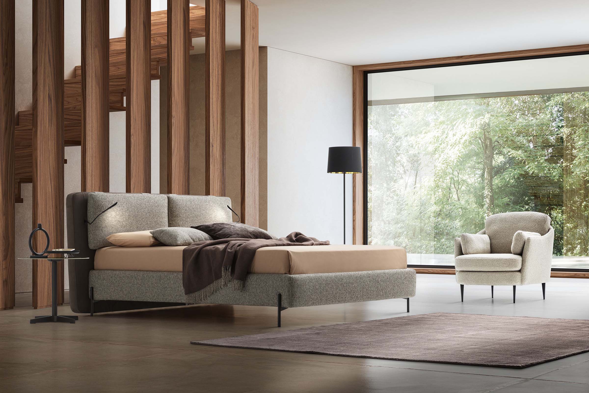 Modern bedroom with a modern bed with integrated LED lights and thin feet