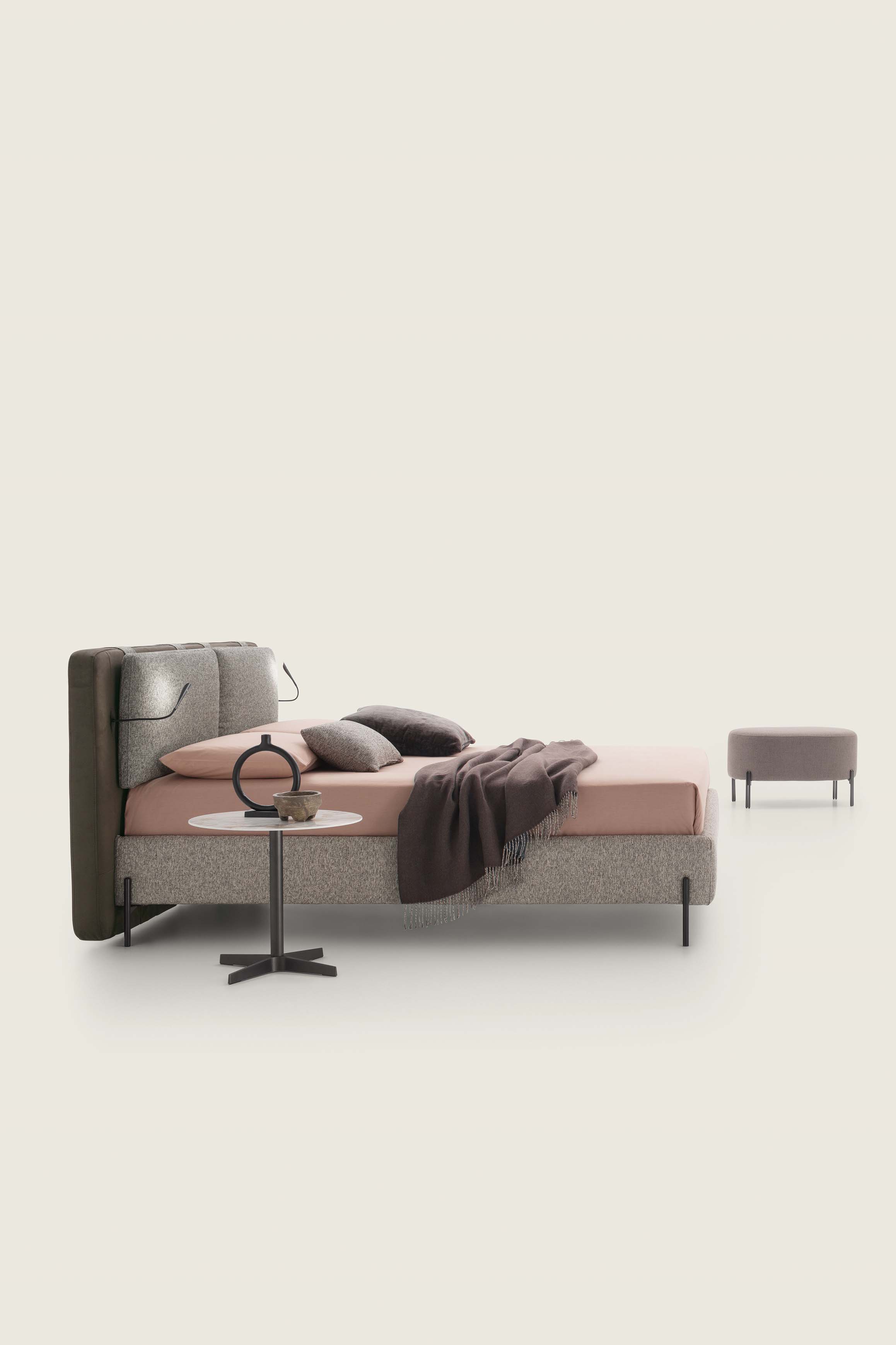 Bed with gray frame and dark brown headboard