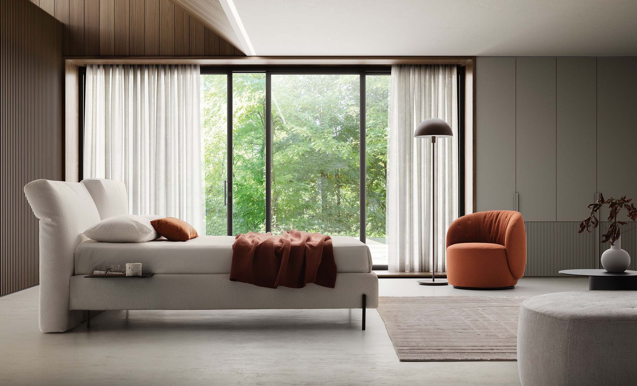 Modern room furnished with a white bed with adjustable headboard
