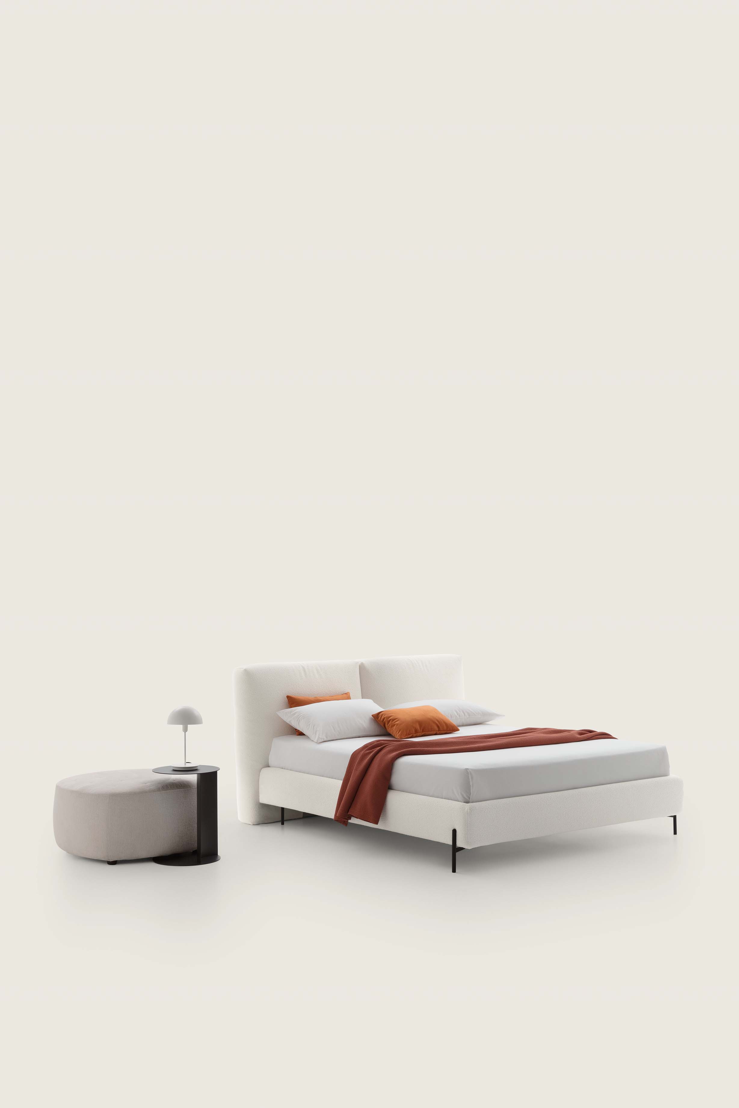 Modern white bed with high painted steel feet and medium bed frame