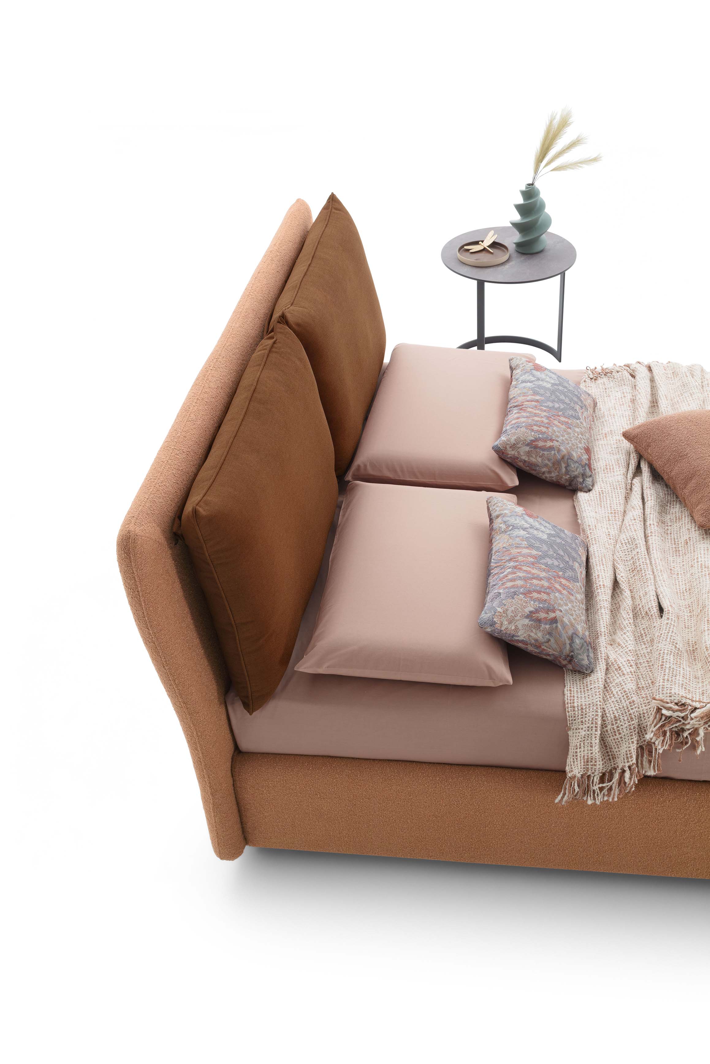 Detail of the double headboard of a classic bed: rigid panel with cushions on top