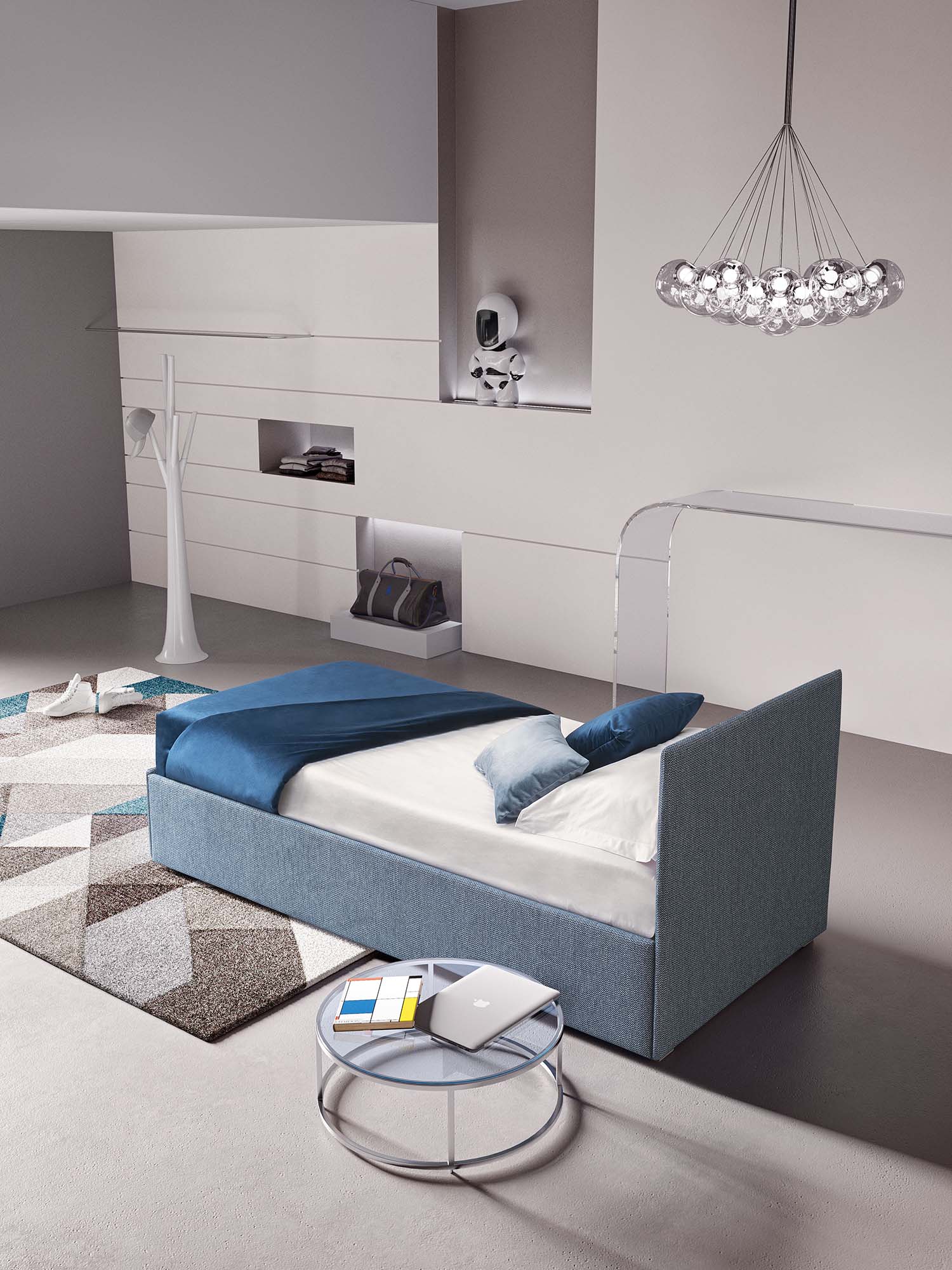 Single bed with very thin headboard and very low feet in a modern studio apartment