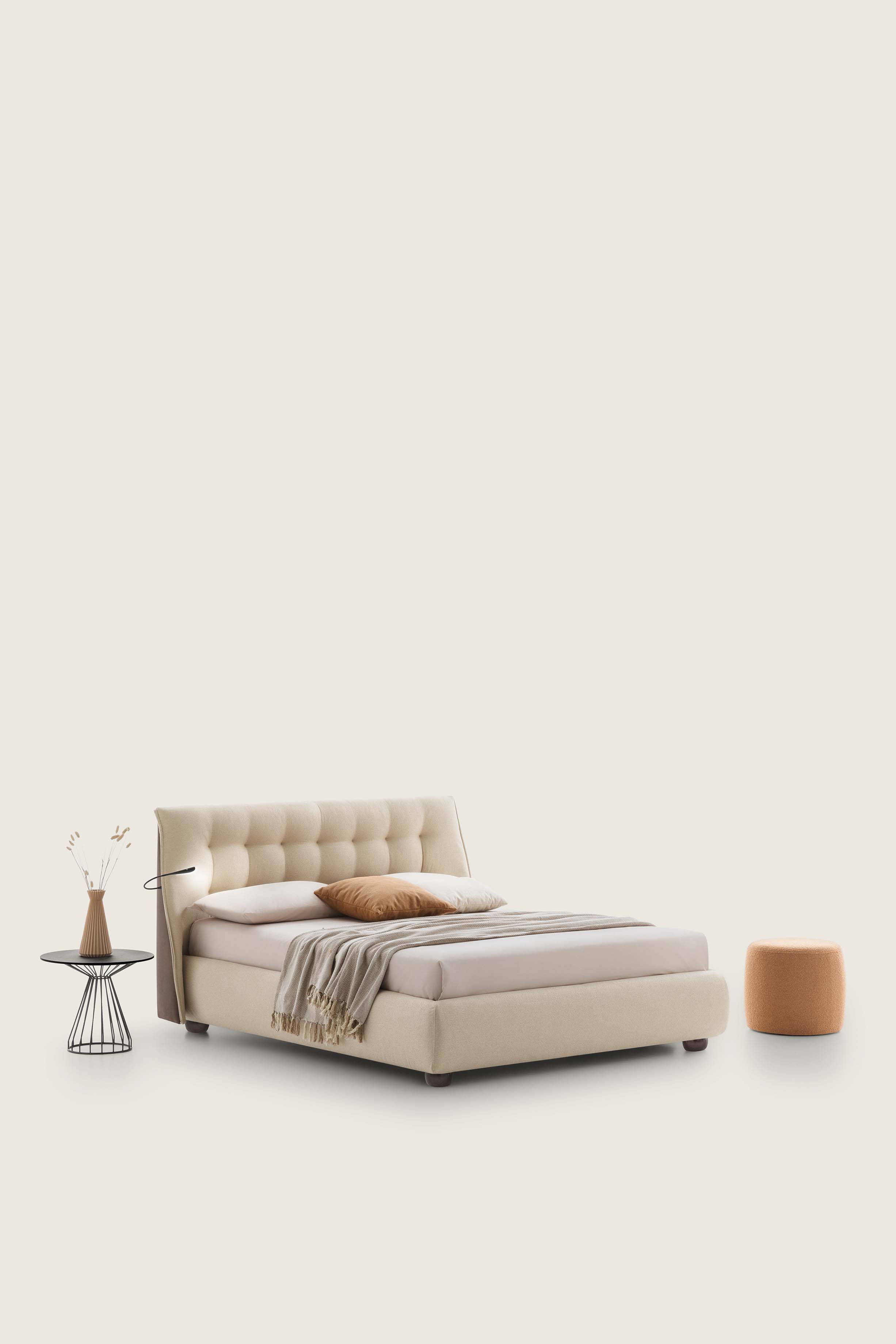 Low two-tone cream and brown Chesterfield-style fabric bed.