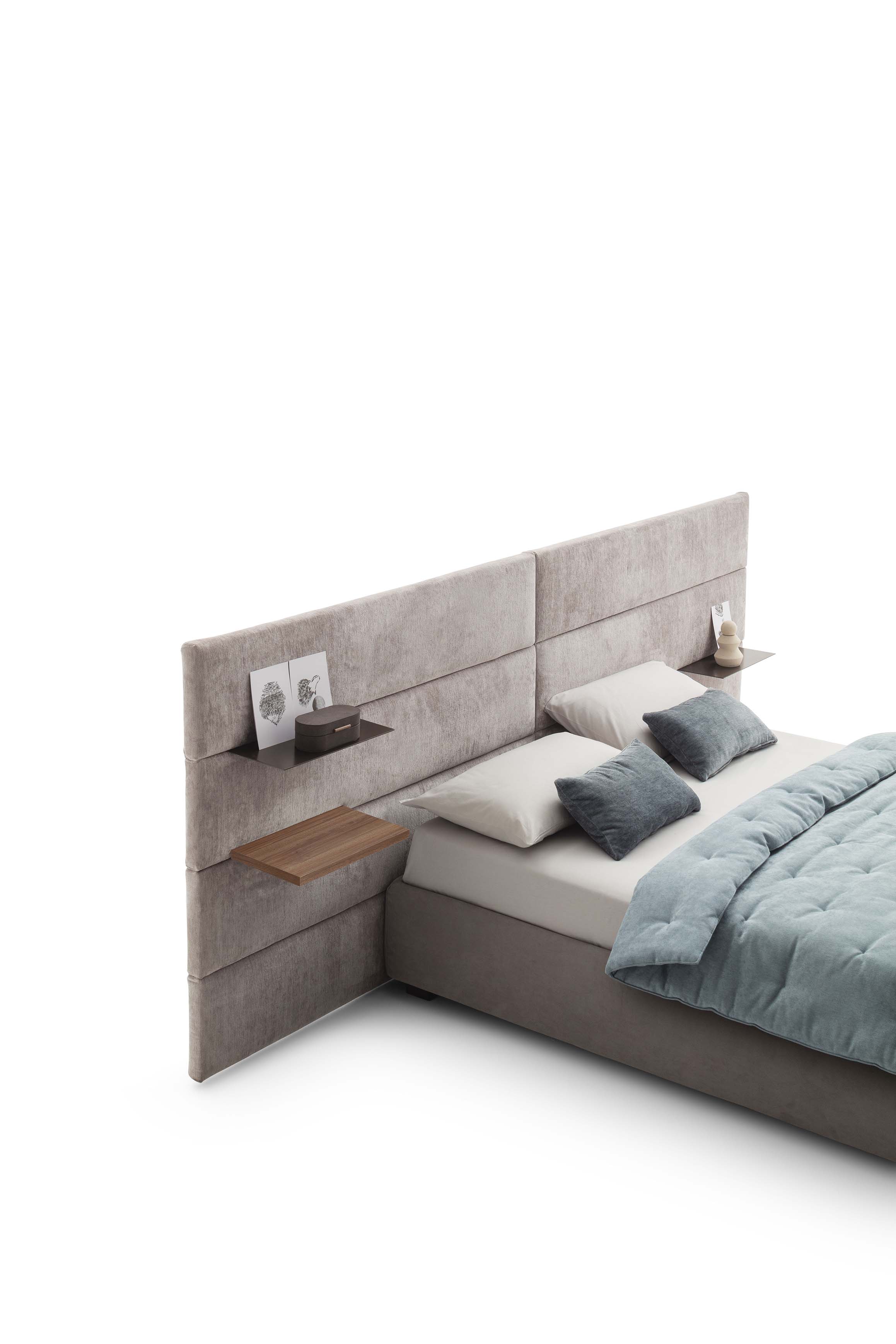 Detail of the wall-mounted headboard of a bed with movable shelves