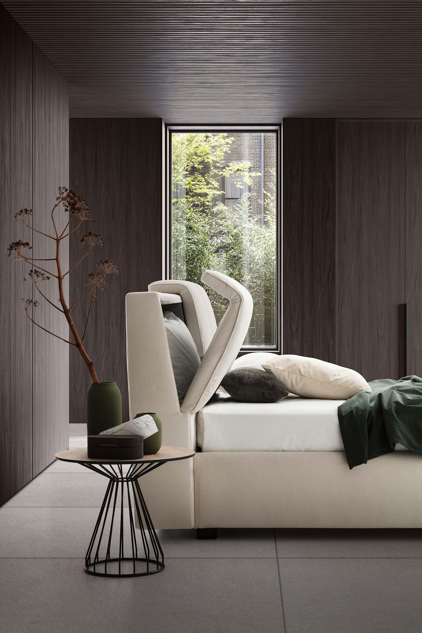 Super modern room furnished with a low double bed with open headboard