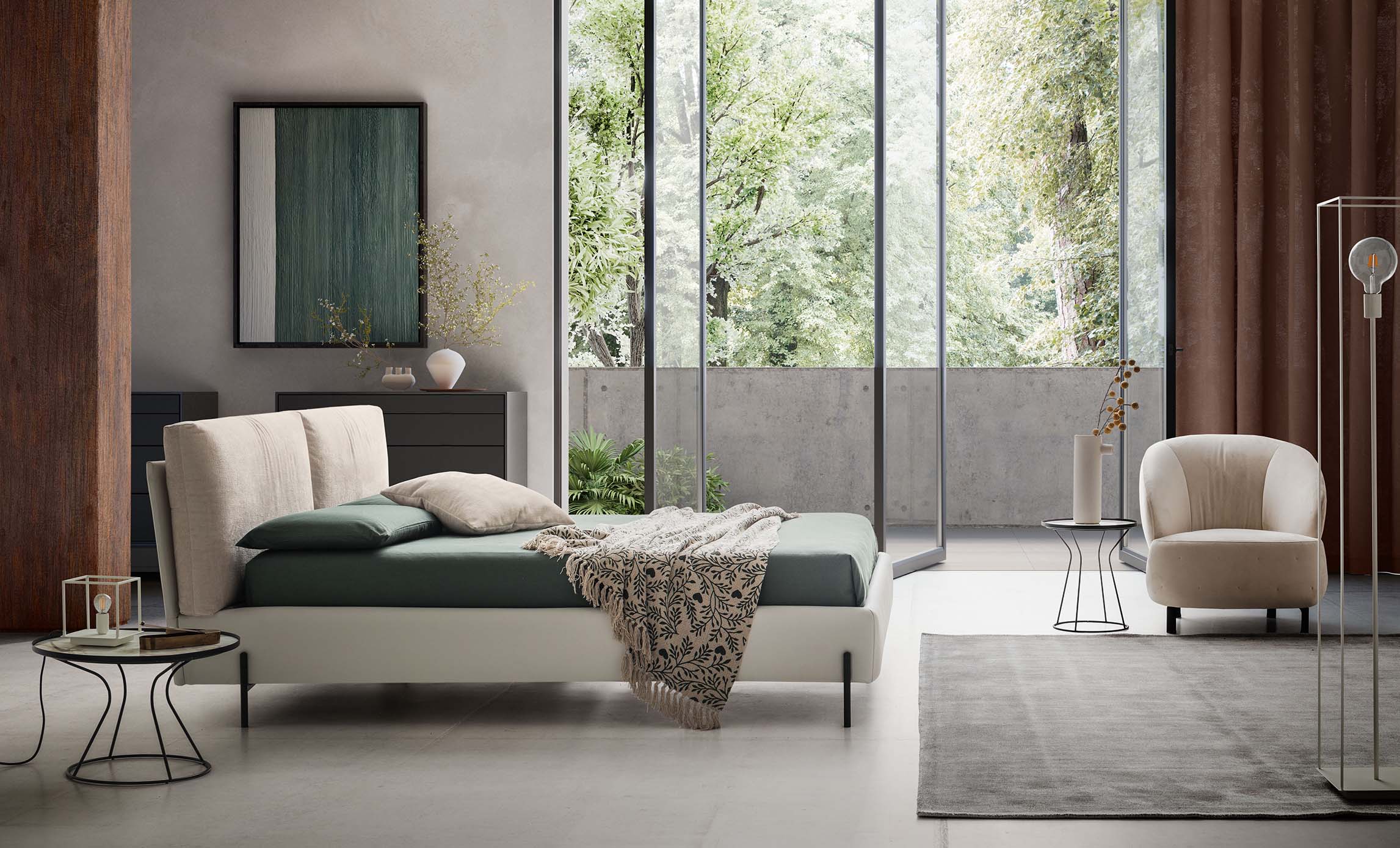 Modern room furnished with a designer bed with thin, high, painted metal feet