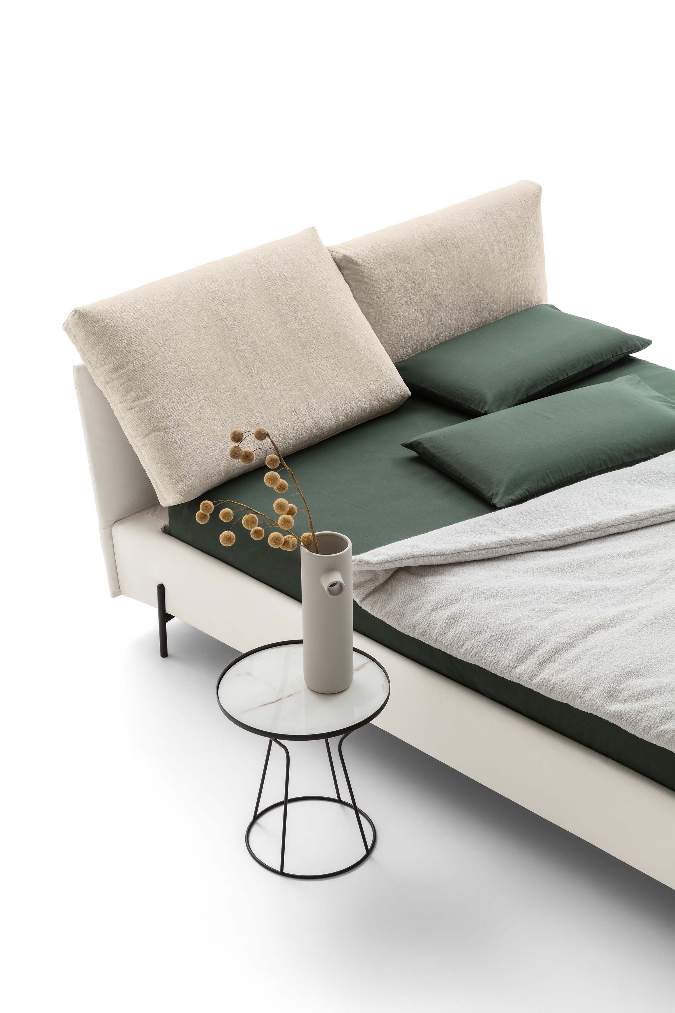Detail of the movable cushions on the headboard of a comfortable modern bed
