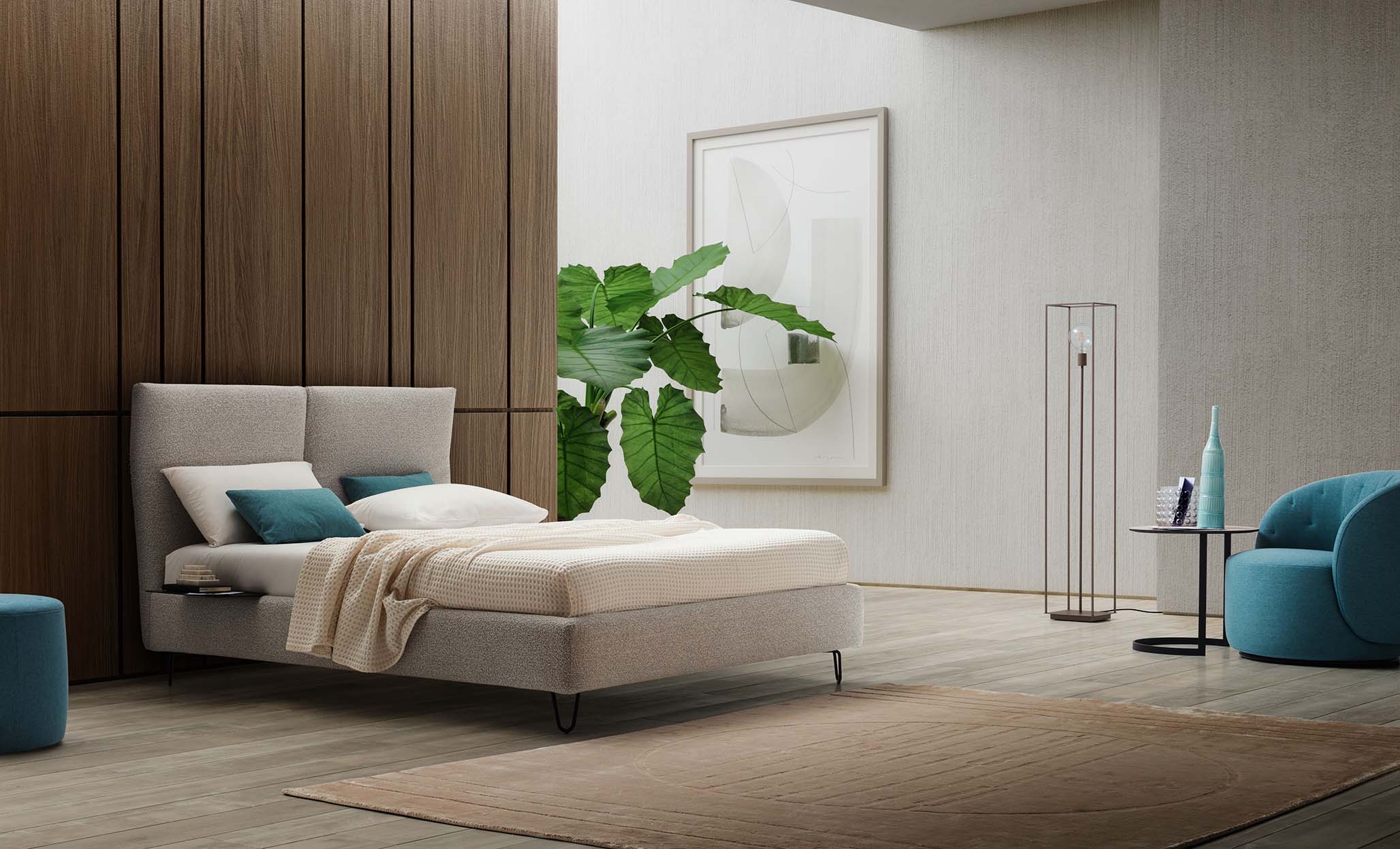 Large room with cool tones furnished with a modern gray bed with folding headboard