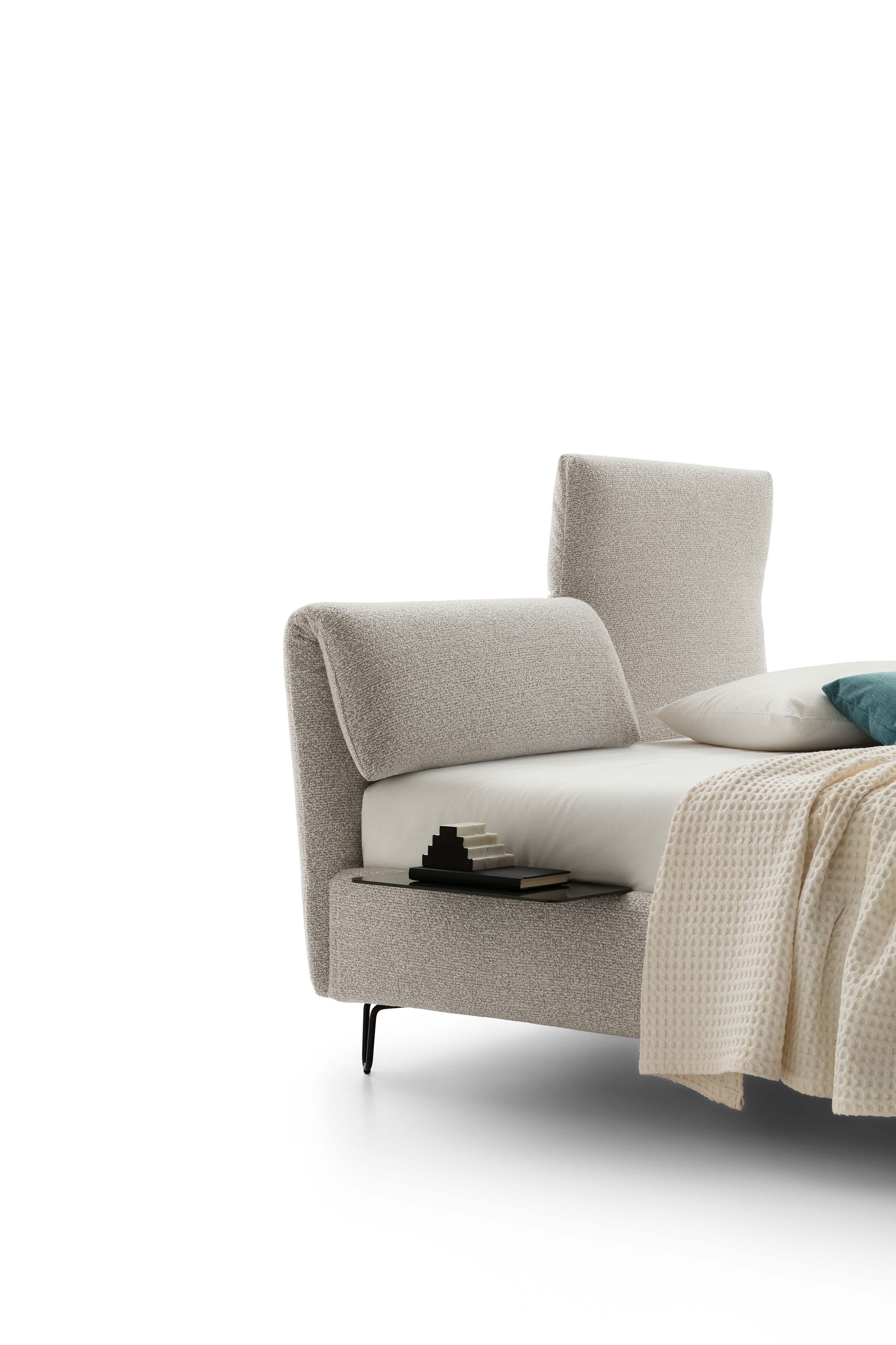Detail of the folding headboard of a modern bed with built-in side shelf