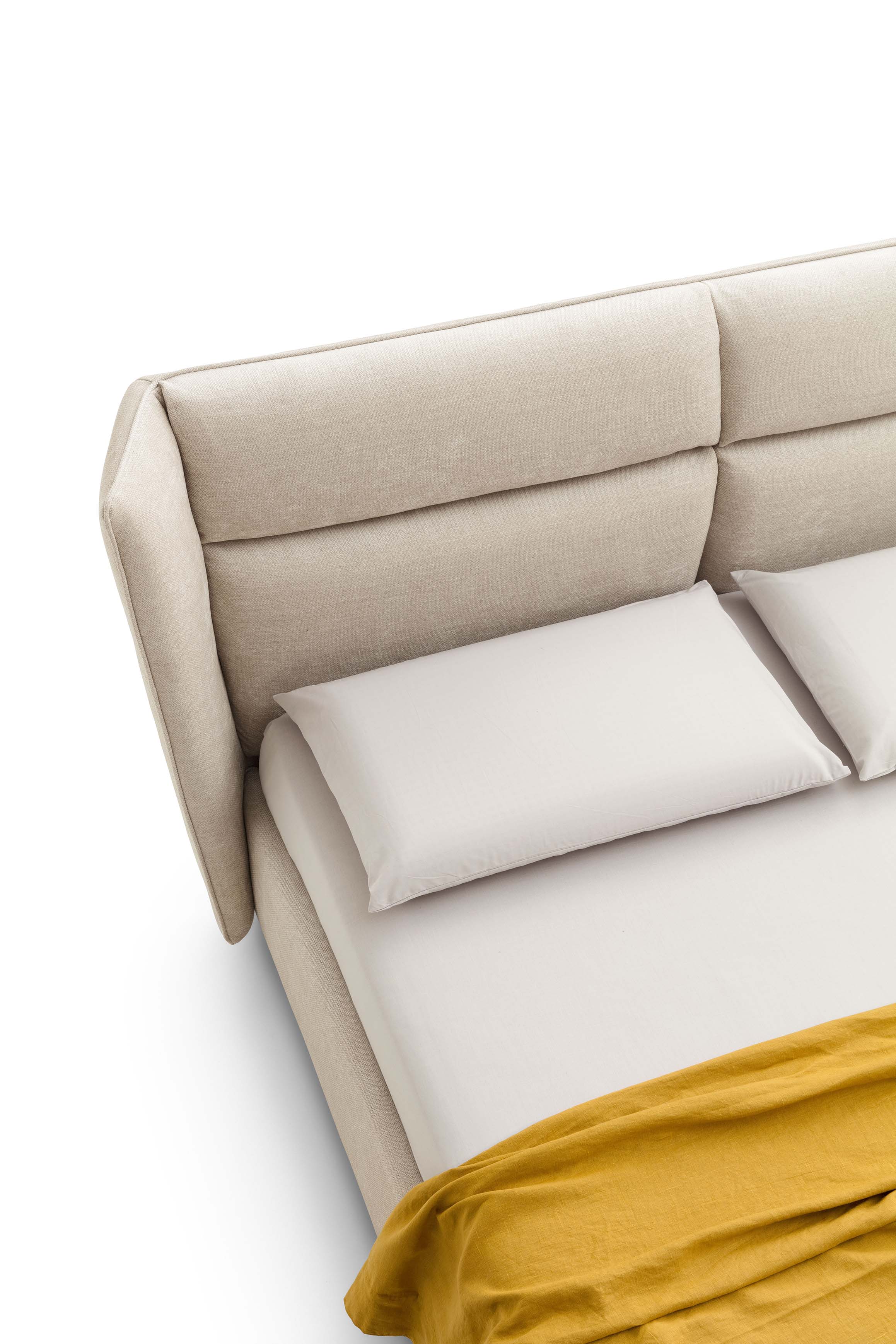 Bed with high winged headboard