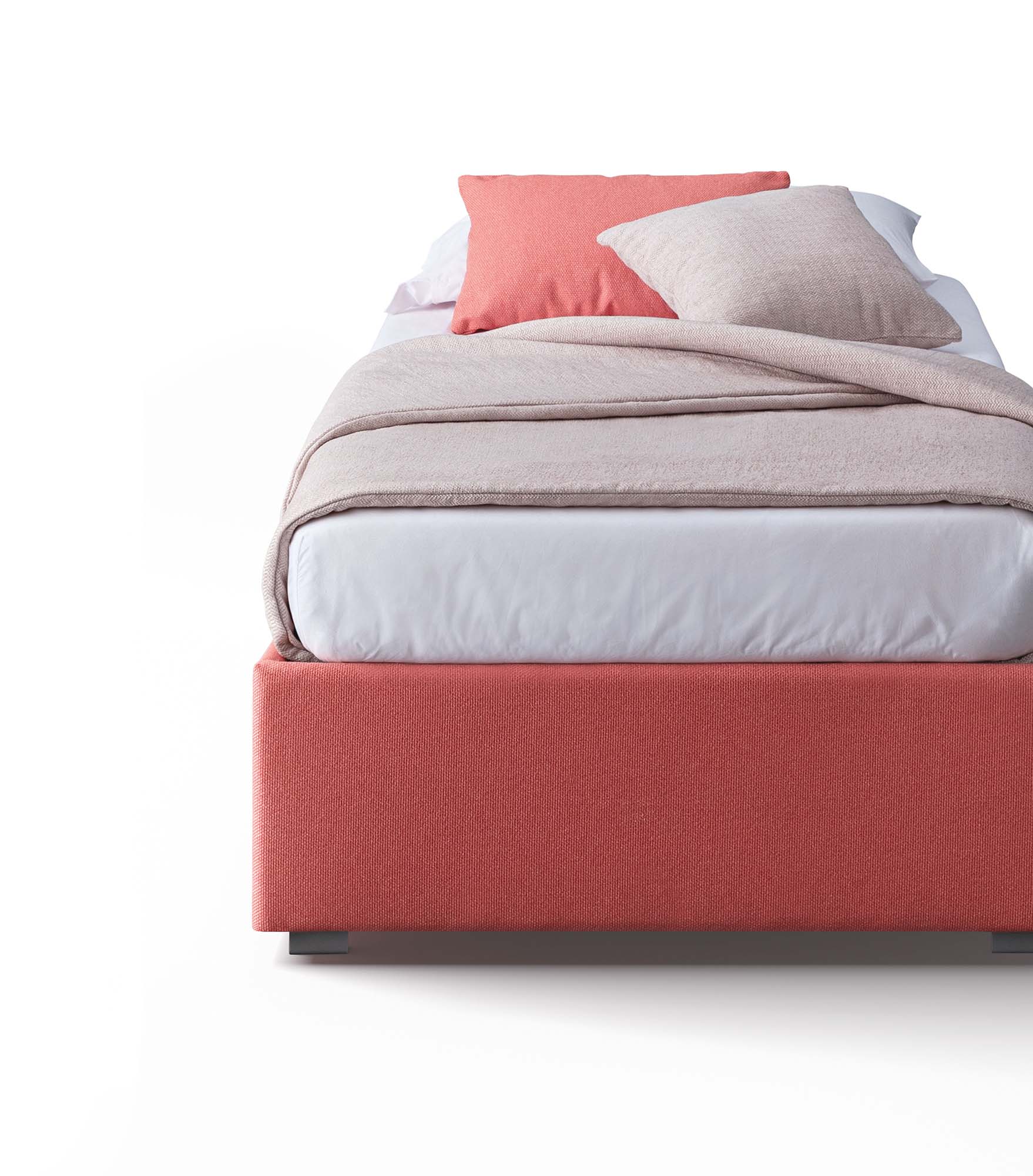 Single bed with sheets and blanket and bed frame with very low base