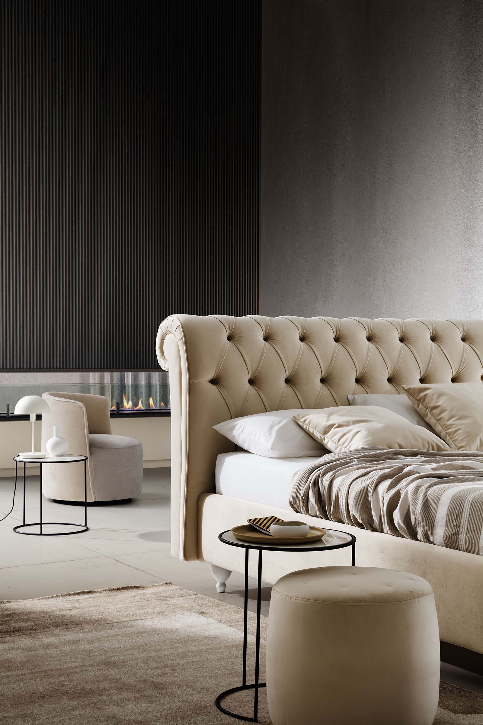 Classic-style double bed with a rolled-top tufted headboard.