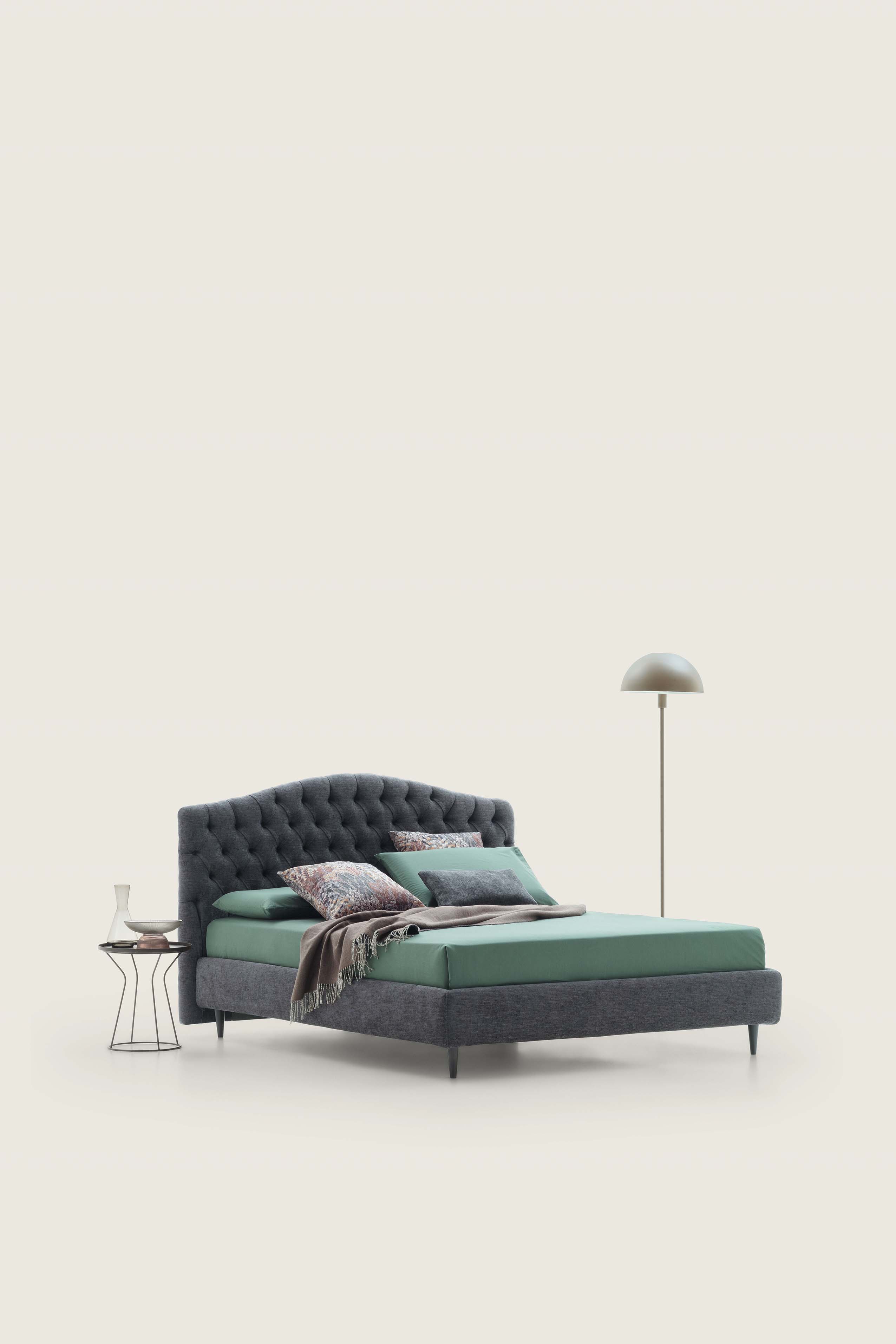 Dark gray fabric double bed in classic style with capitonné quilted headboard
