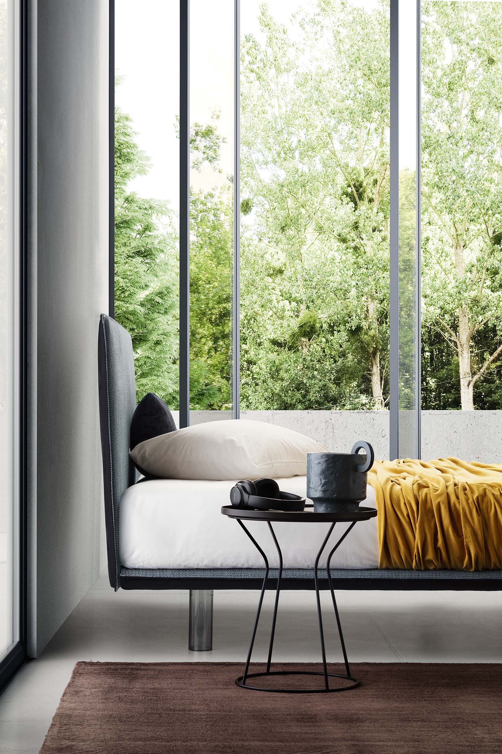Space-saving double bed with a very thin structure in a modern and bright room