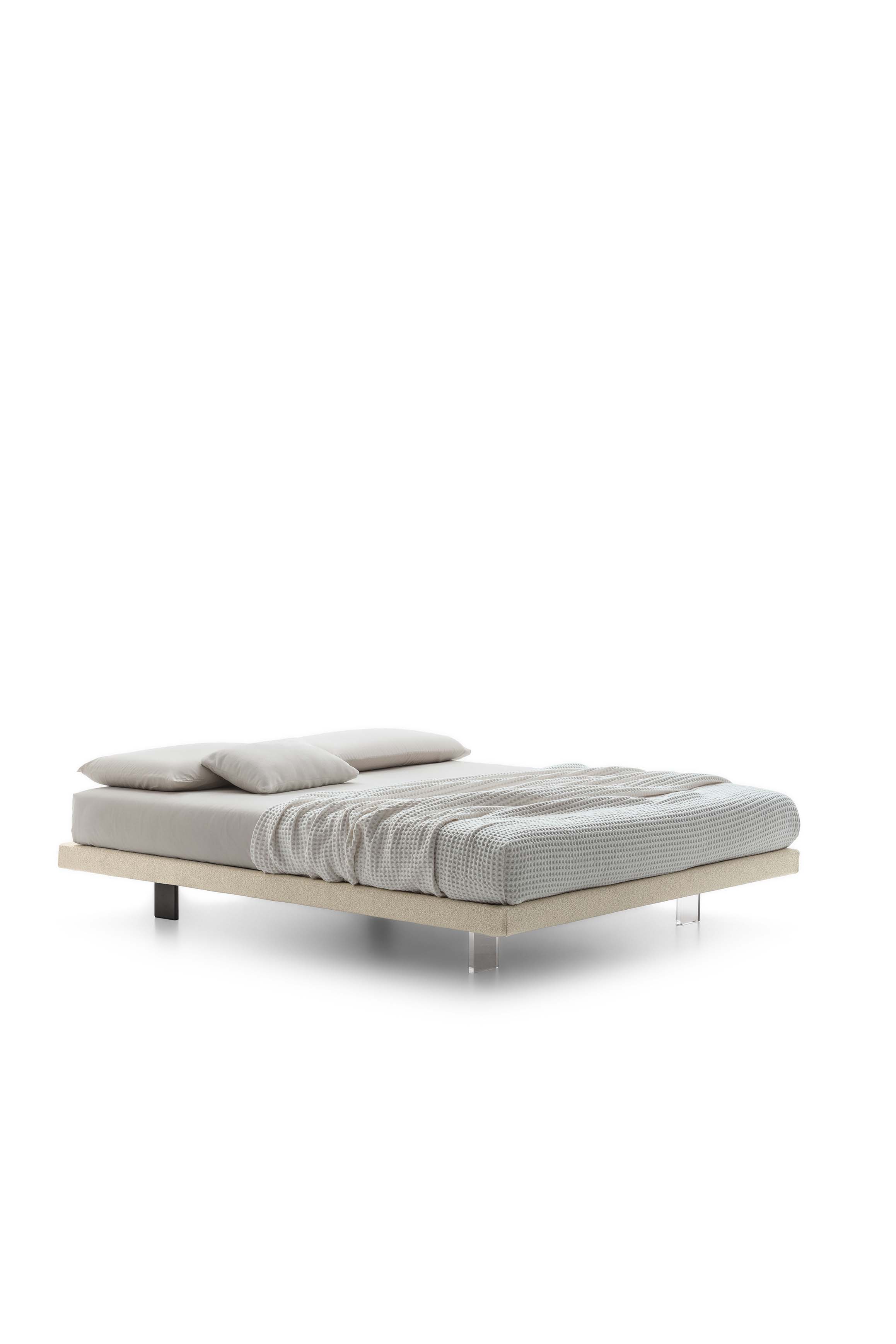 Bed without headboard with transparent plexiglass feet