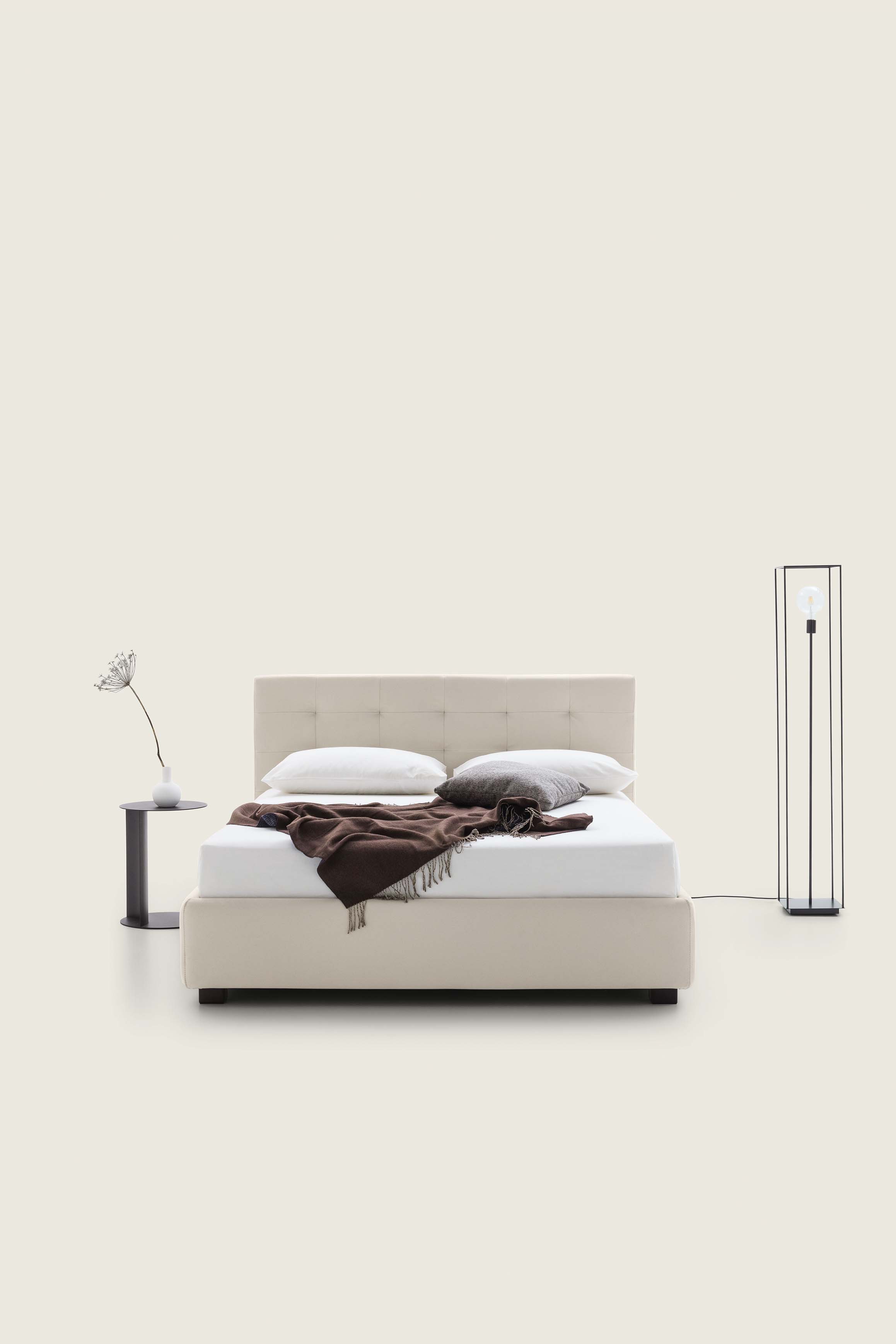 Modern white/cream double bed with rectangular quilted headboard