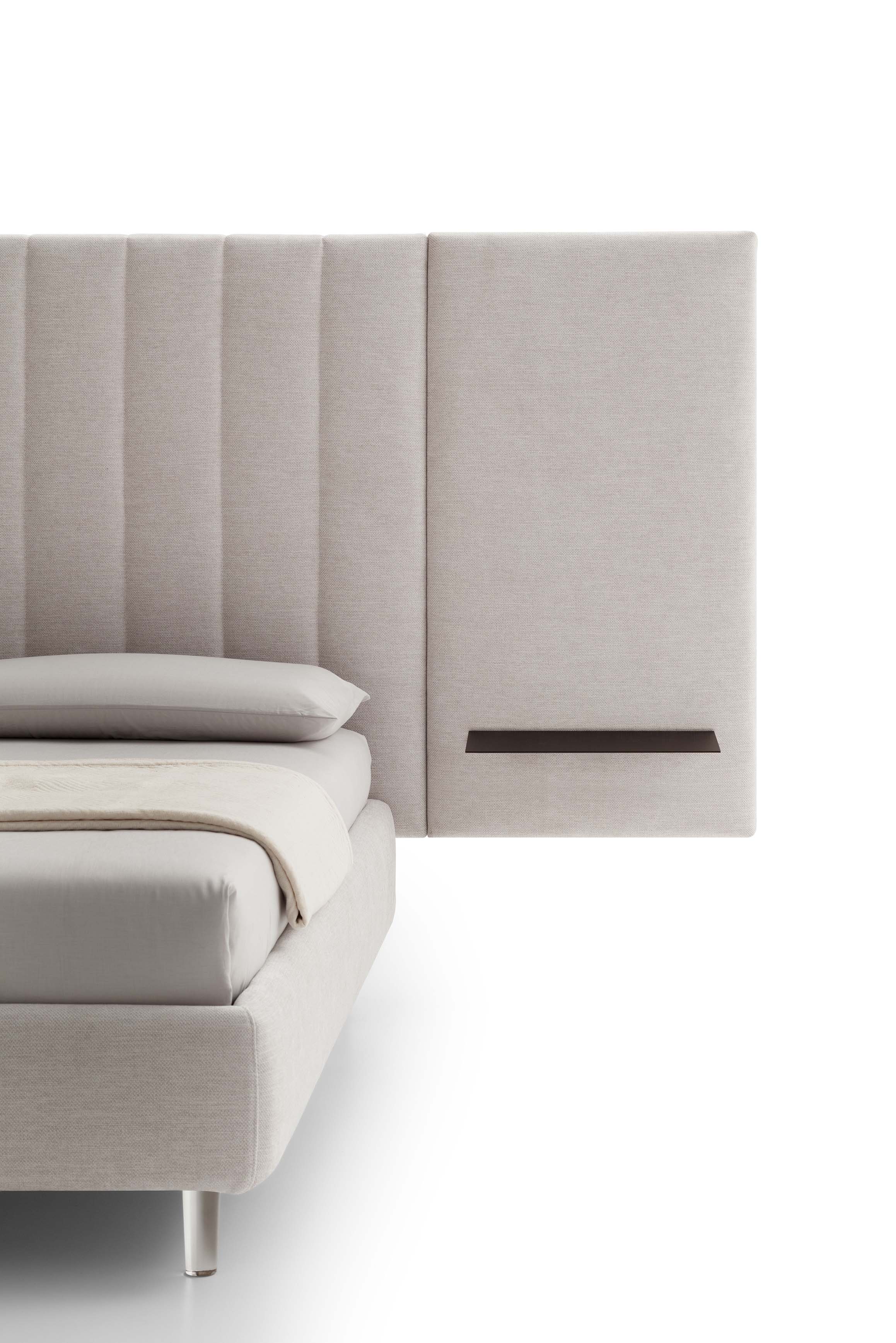 Detail of the upholstered headboard with metal shelf of a contract bed