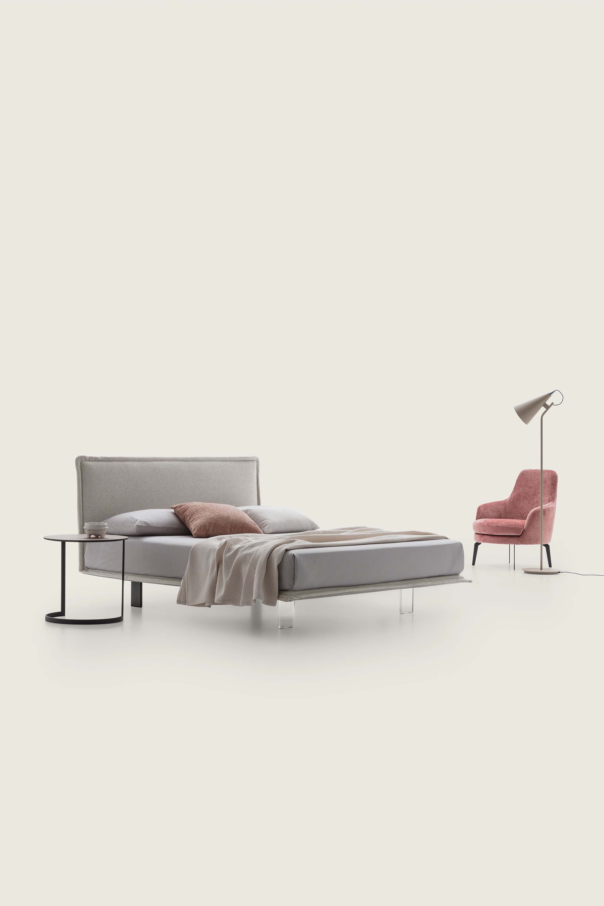 Super-thin upholstered silver-gray double bed with high plexiglass feet