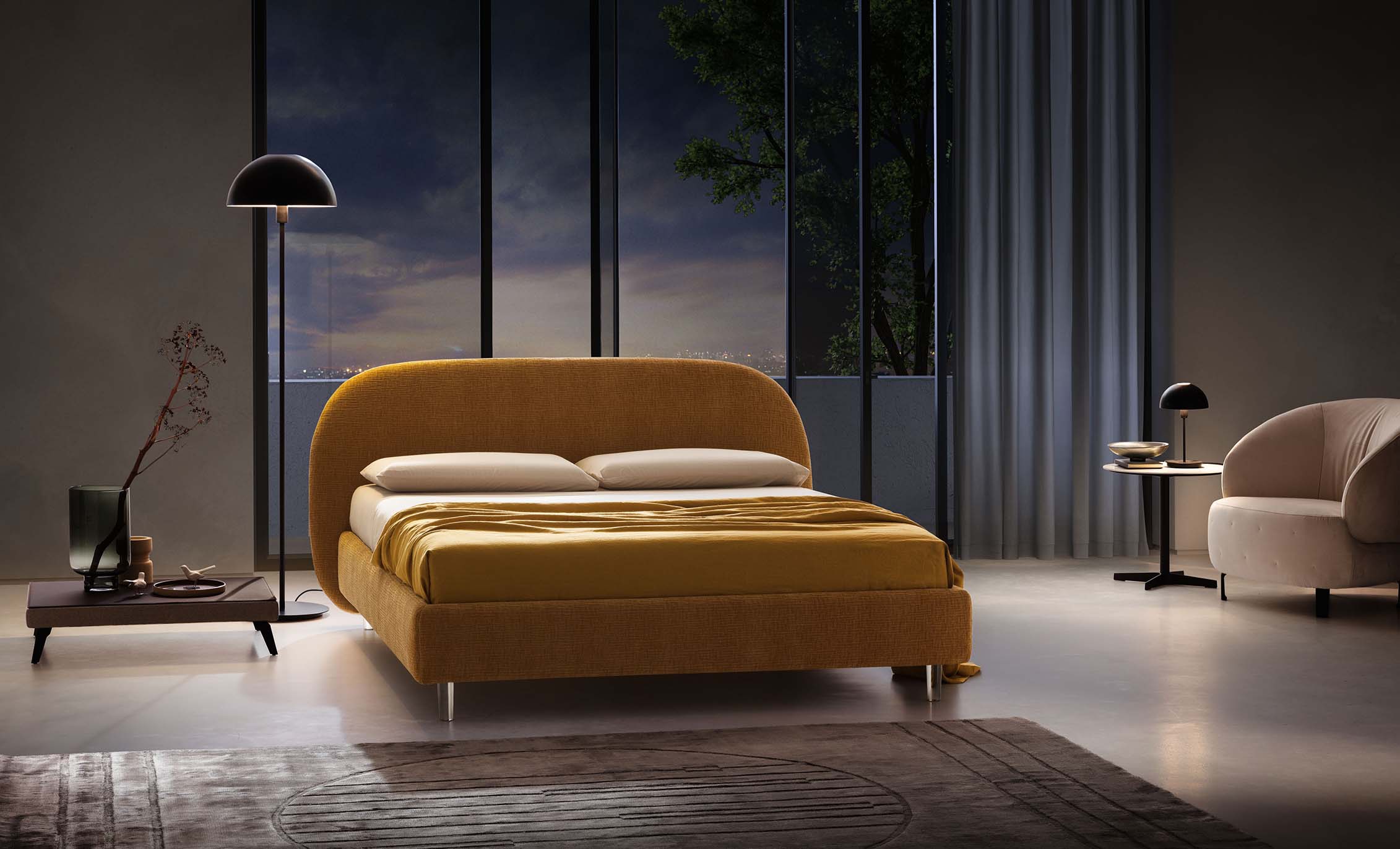 Modern living room with lamps and armchairs and mustard-yellow bed