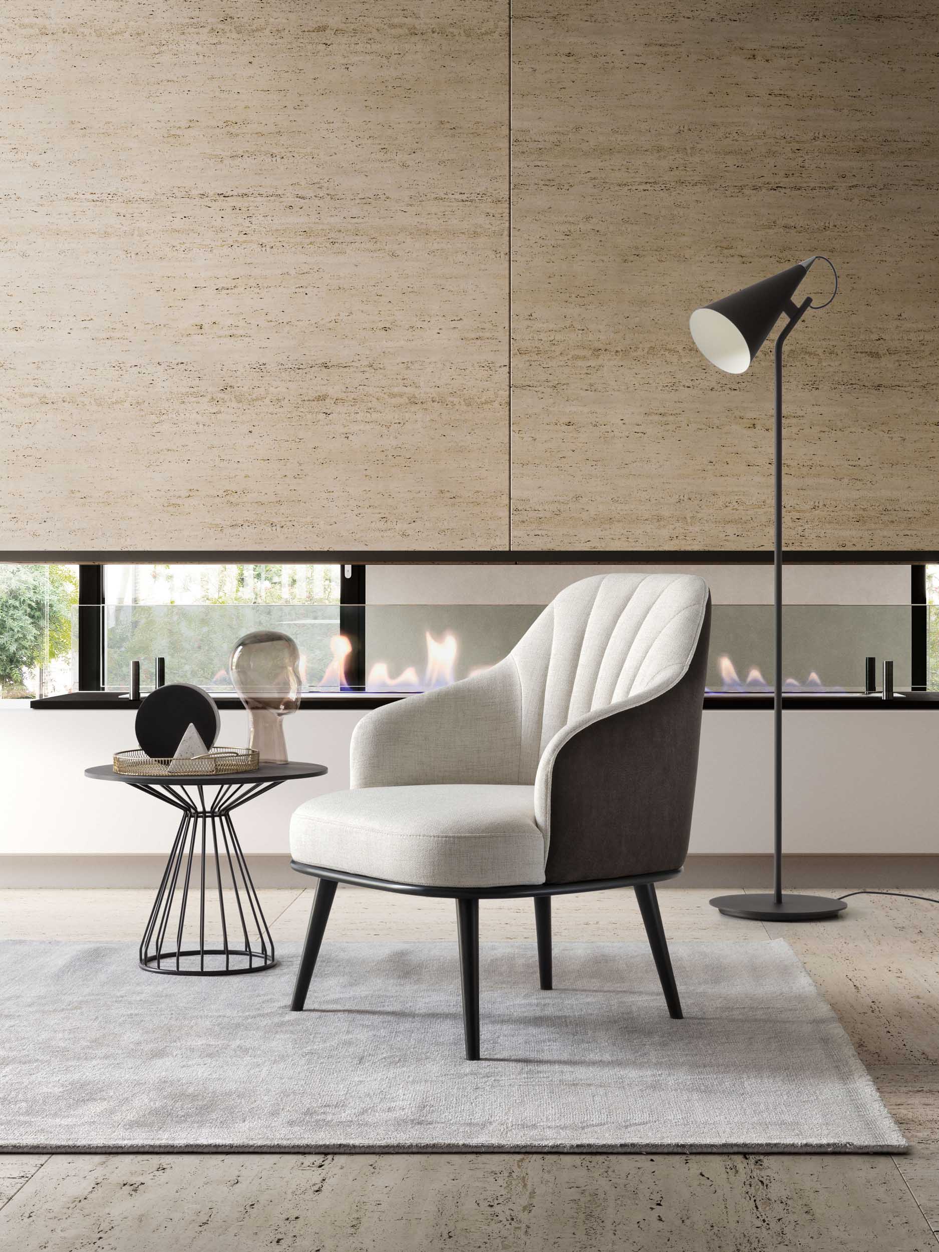 Two-tone armchair in white and black with sleek legs