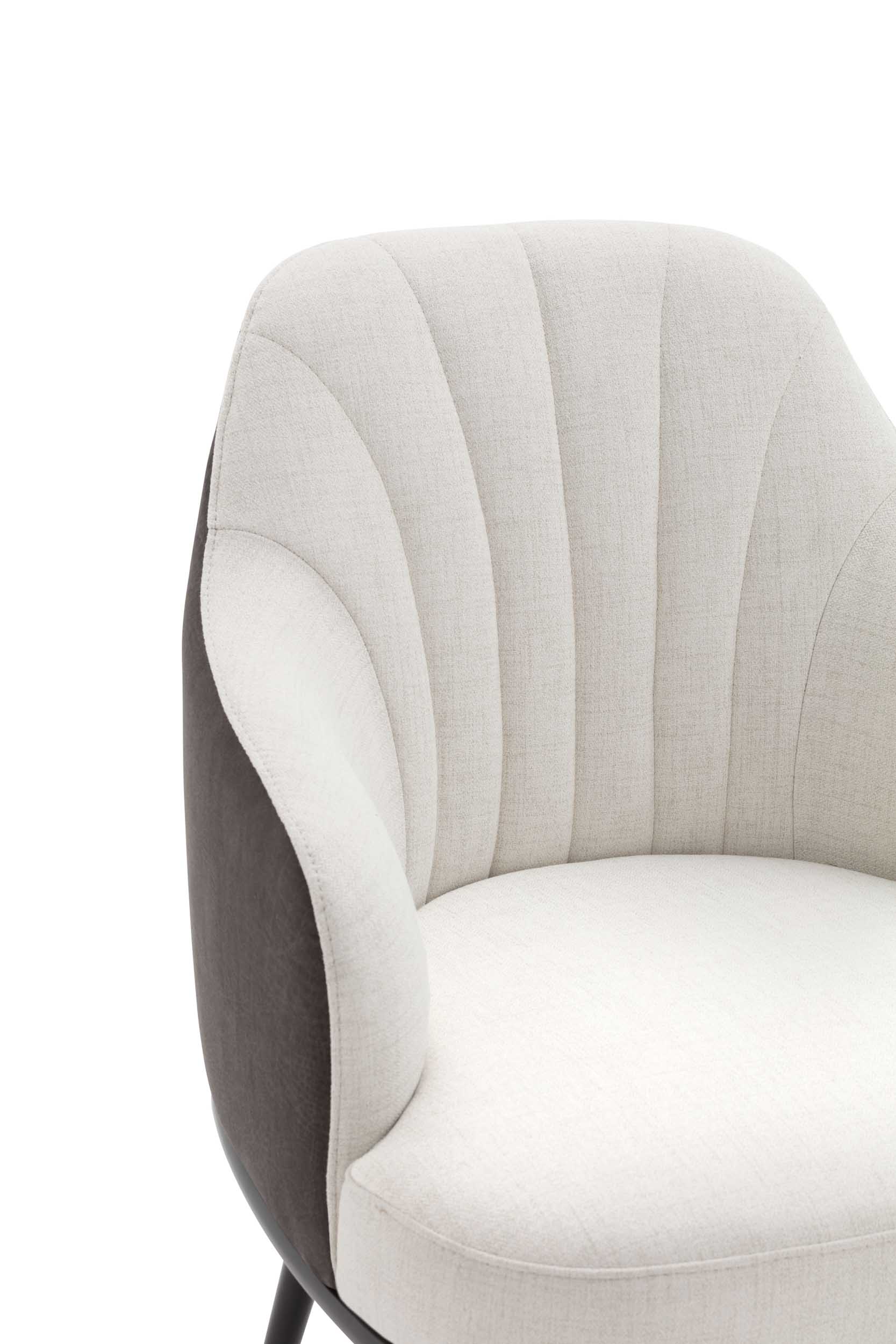 Close-up of vertical quilting on a white armchair