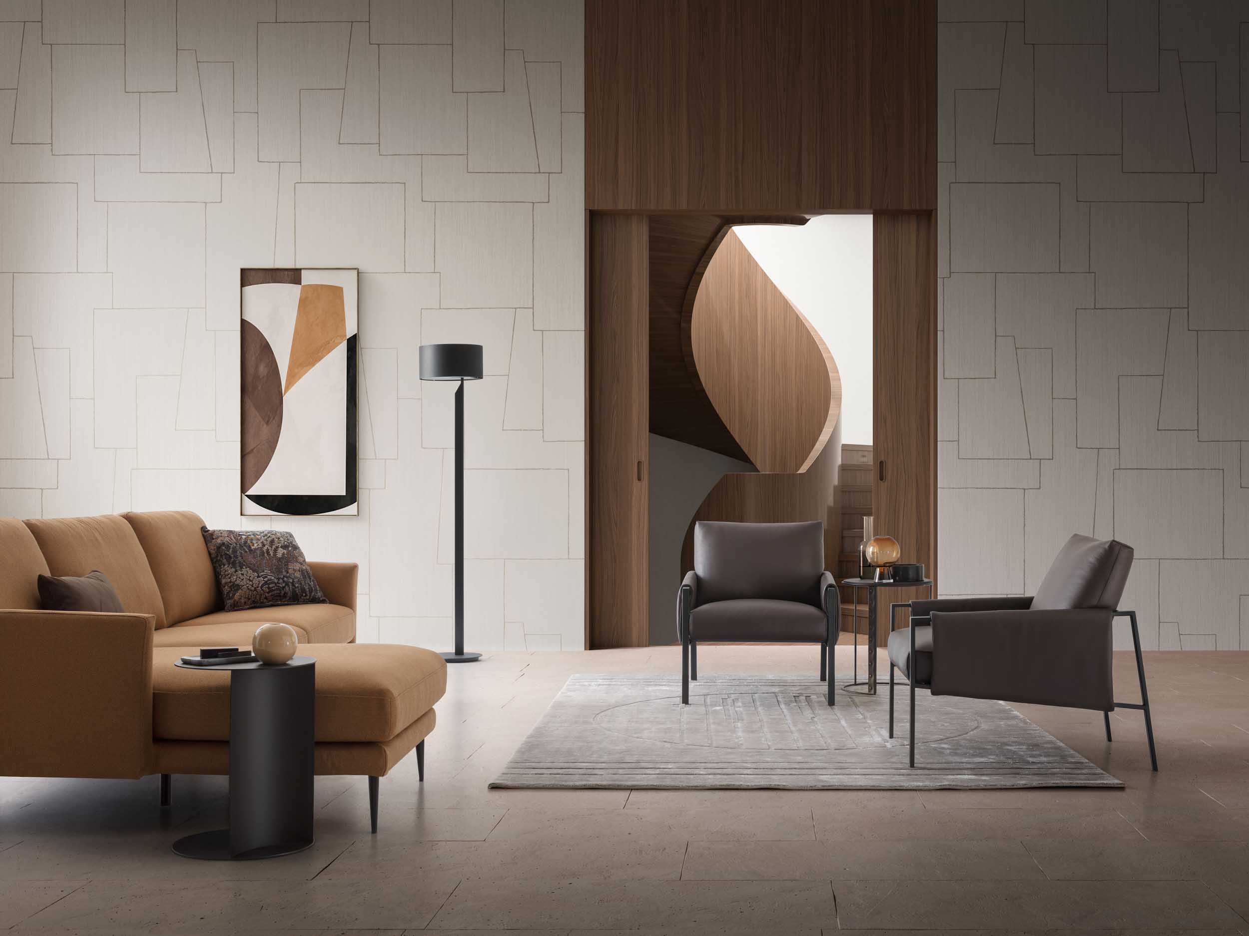Dark leather armchairs in a modern and designer living room.