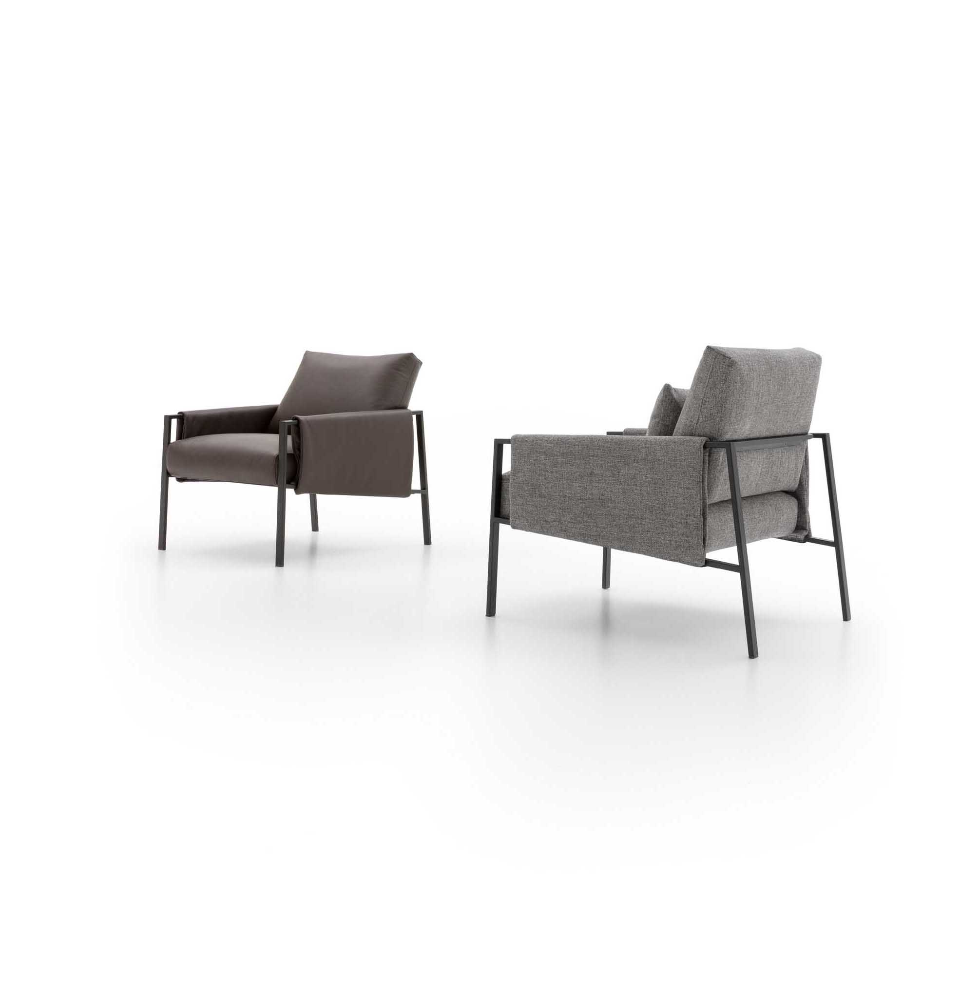 Industrial-style upholstered armchair with a black metal frame
