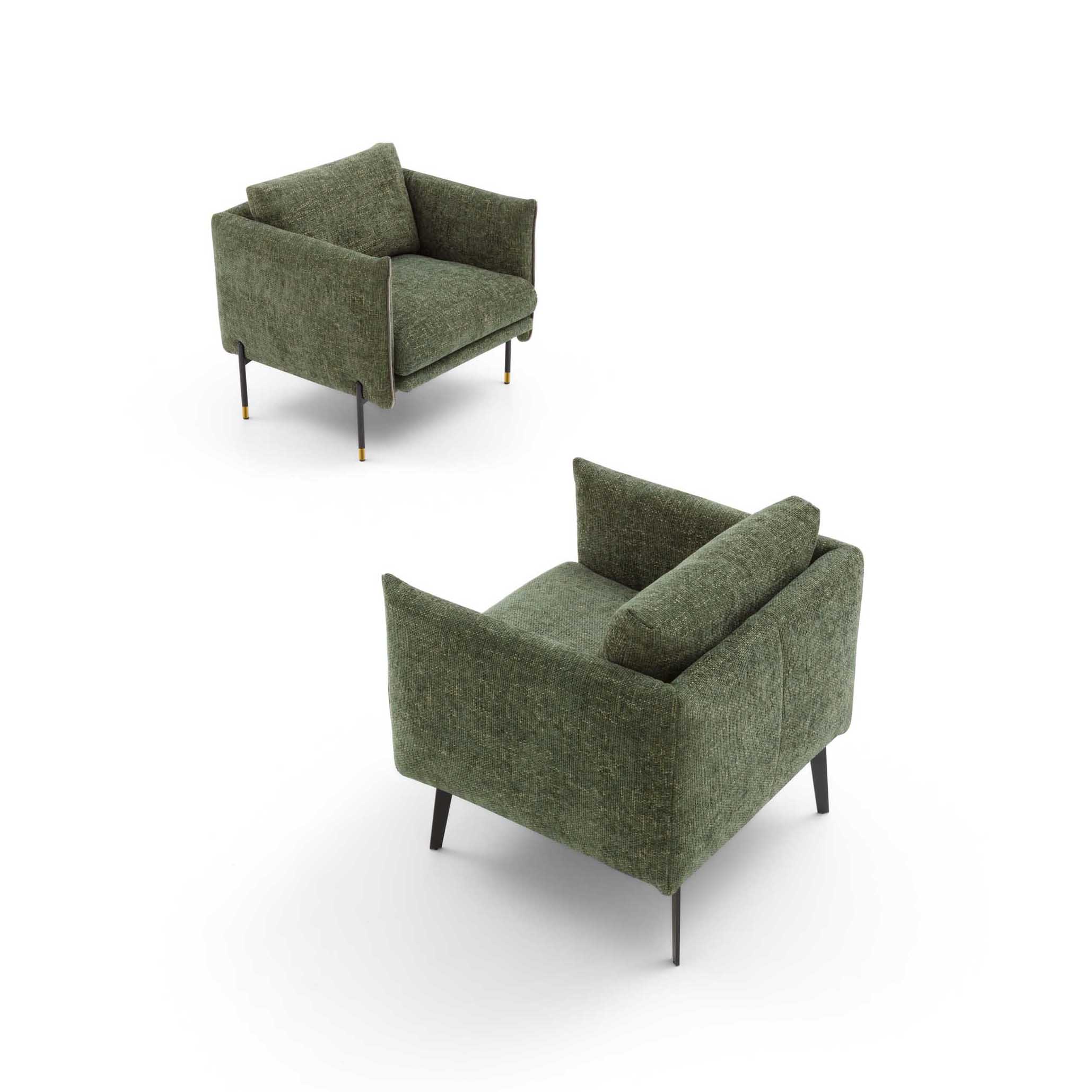 Green armchair with tall legs and padded backrest