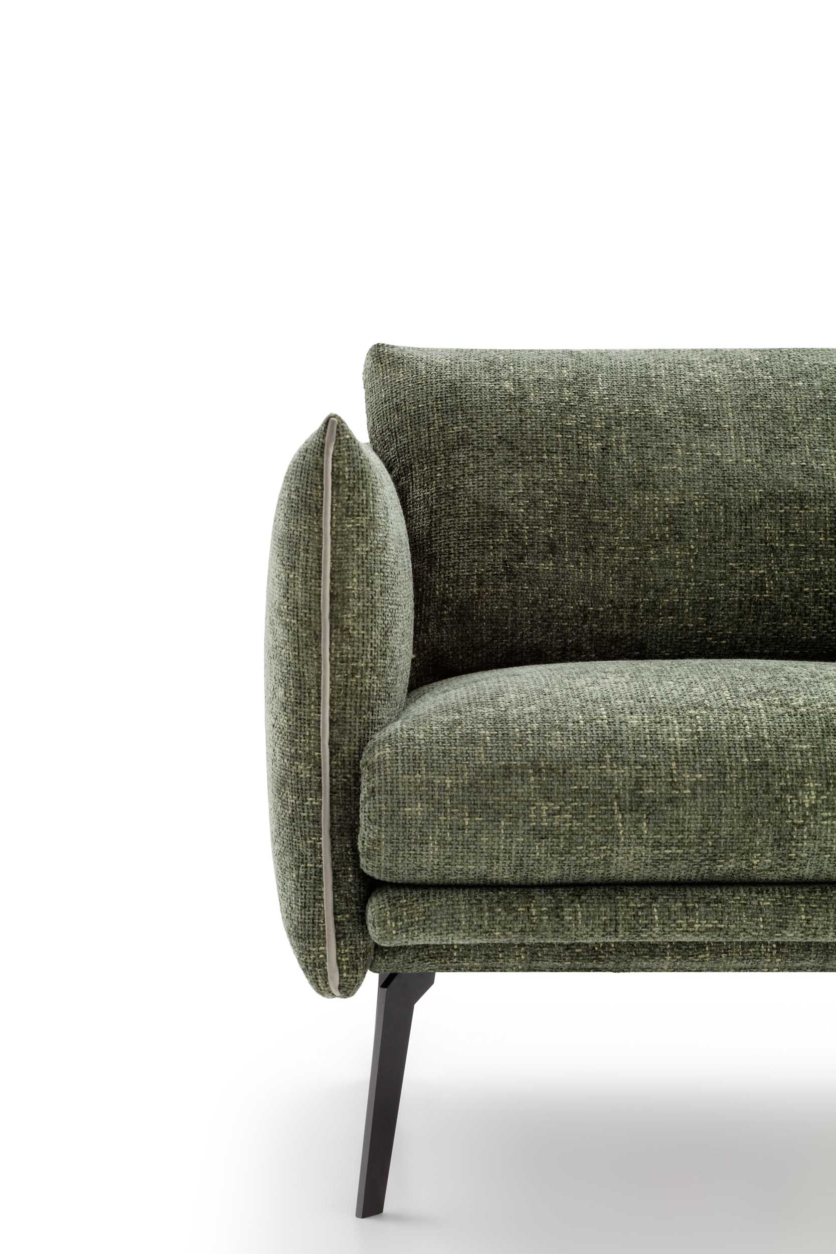 Close-up of an armchair armrest with contrasting piping