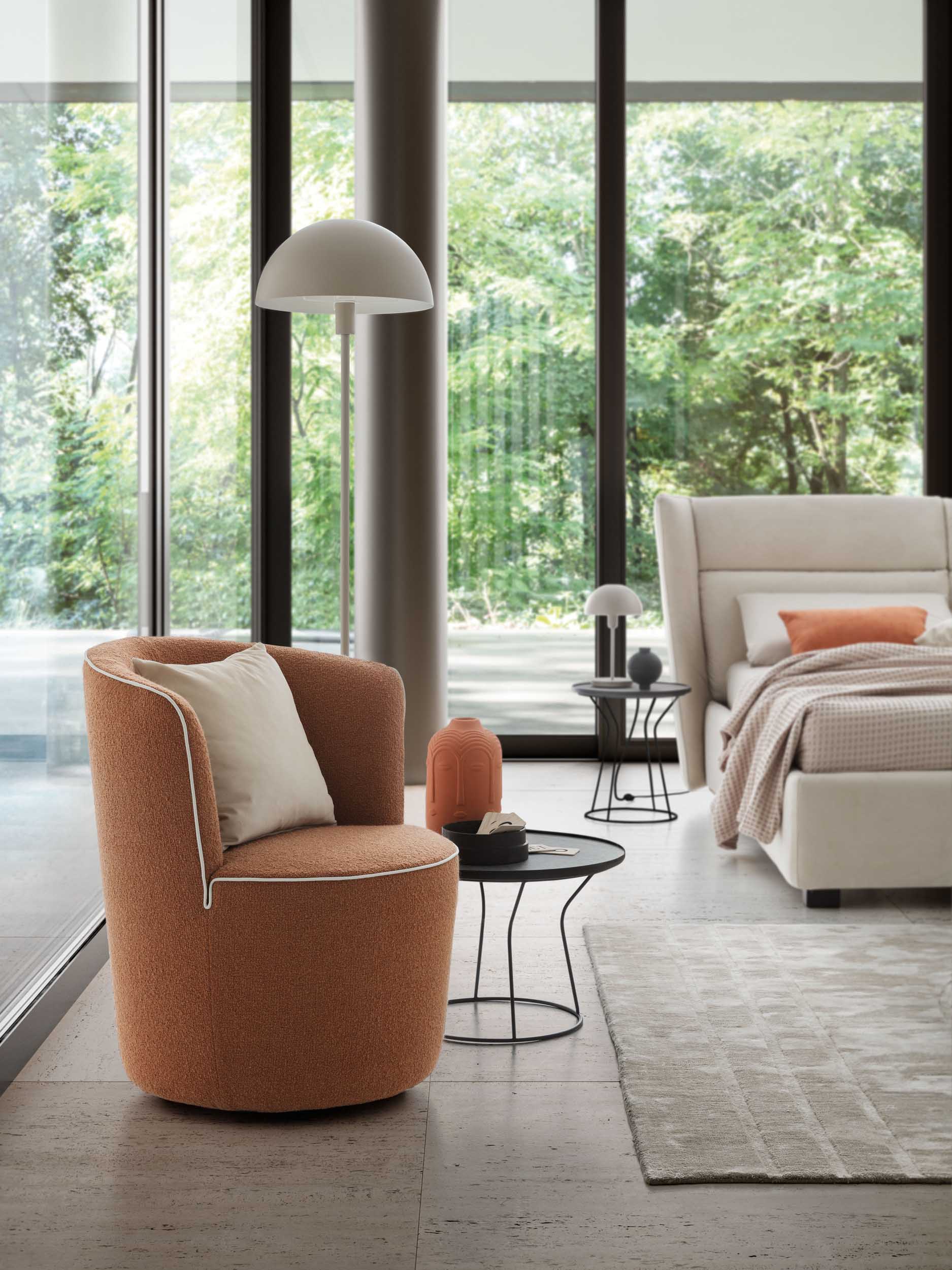 Copper-colored armchair with white trim and cushion in a bedroom