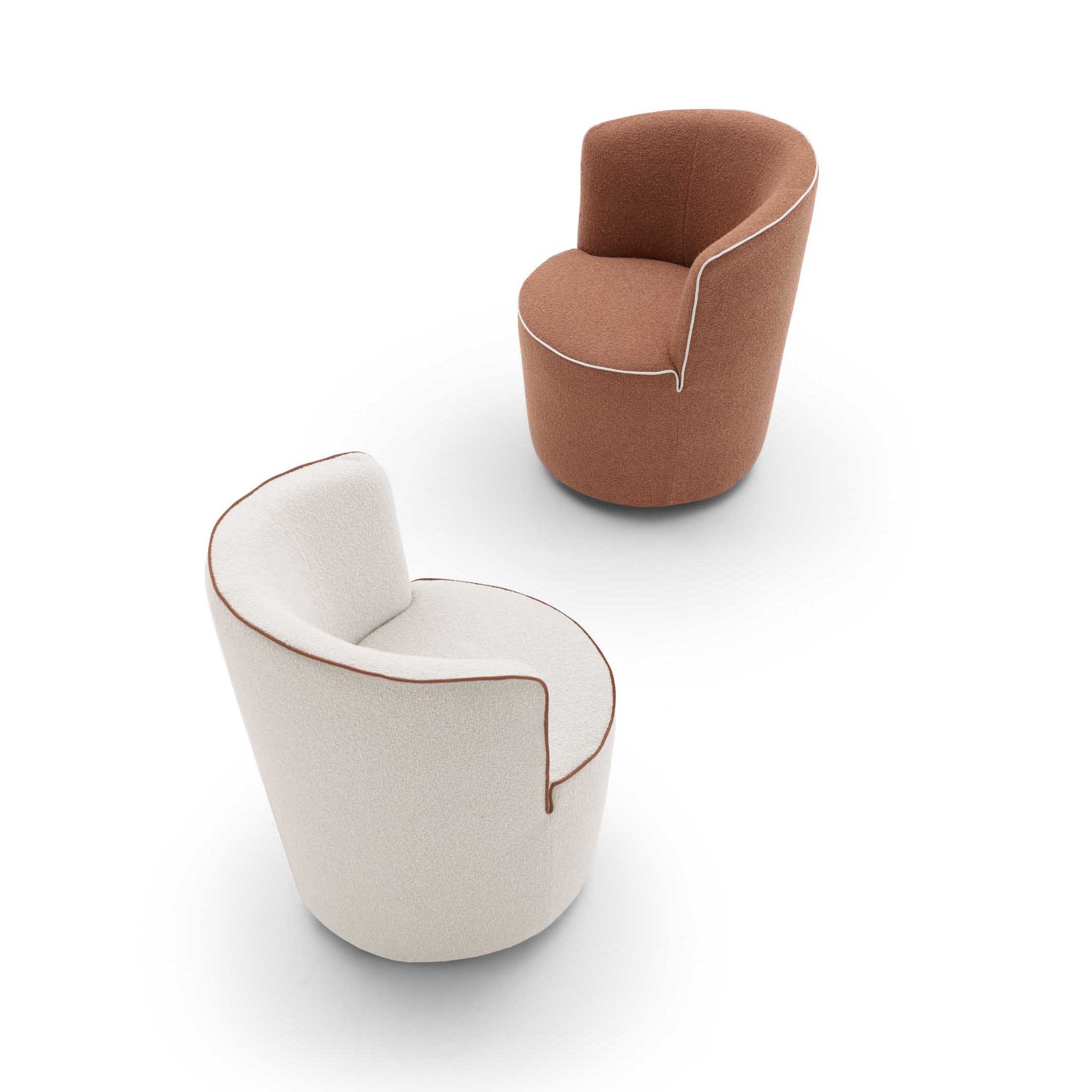 Barrel-shaped armchairs in white and copper with contrasting piping