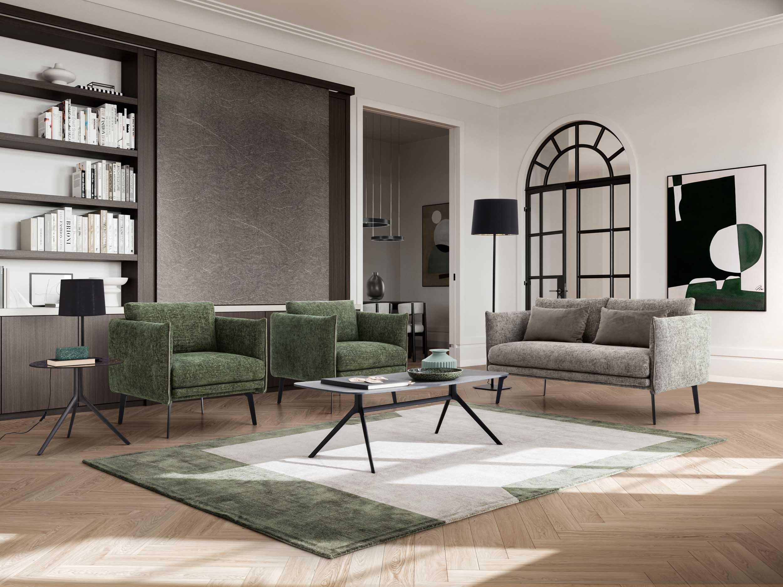 Lounge area with green Boon armchairs and a gray loveseat