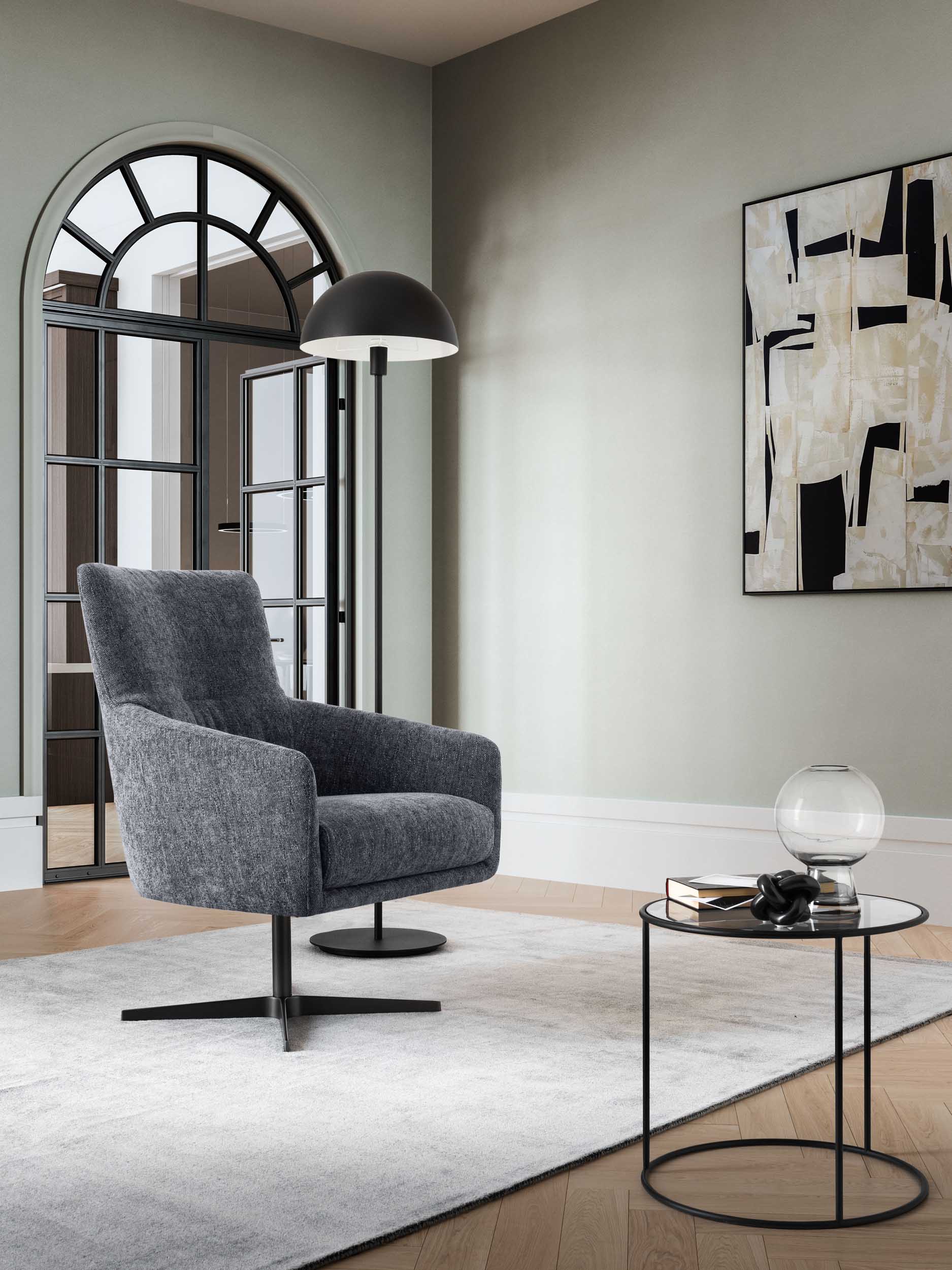 Comfortable, swivel gray armchair with armrests in an entryway