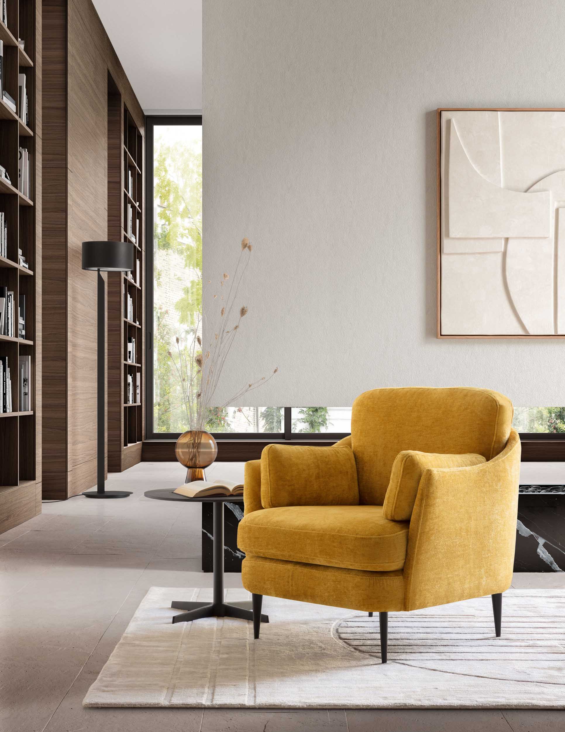 Yellow armchair with side cushions in velvet-like fabric.