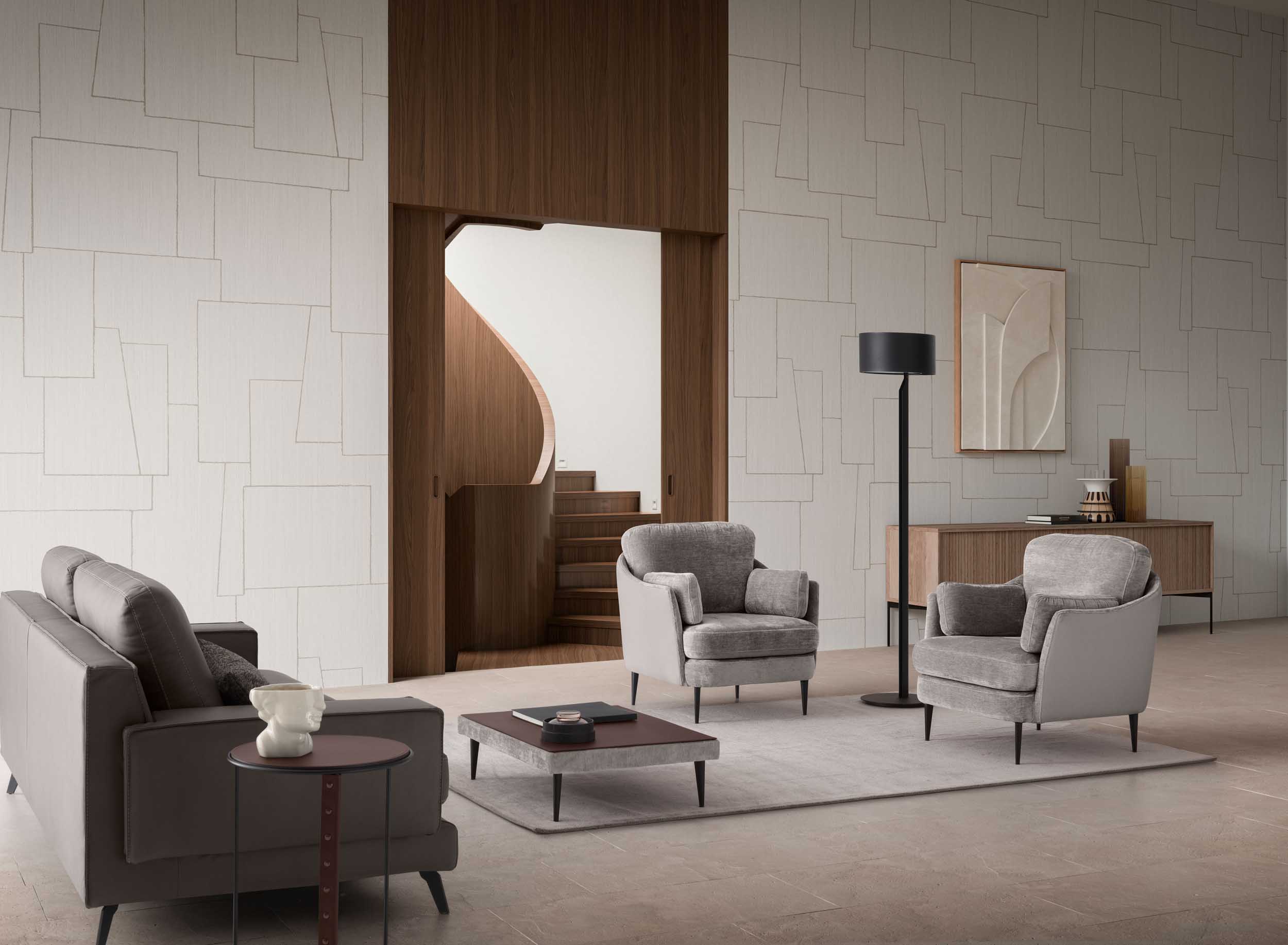 Gray fabric armchairs in a conversation area in the living room
